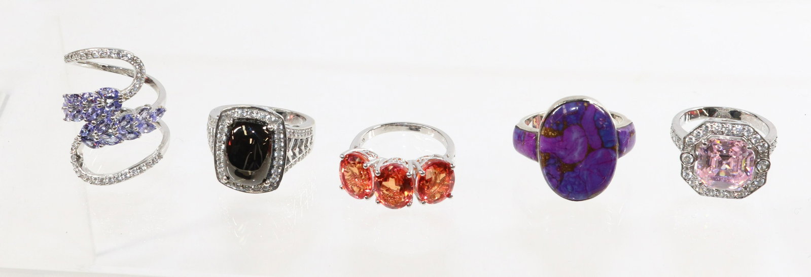CONTEMPORARY STERLING SILVER RING LOT: 5 RINGS- TANZANITE, PURPLE CABOCHON, PINK CZ, ORANGE TOPAZ,- 1.18 OZT SIZE: SIZE-8(4),10
