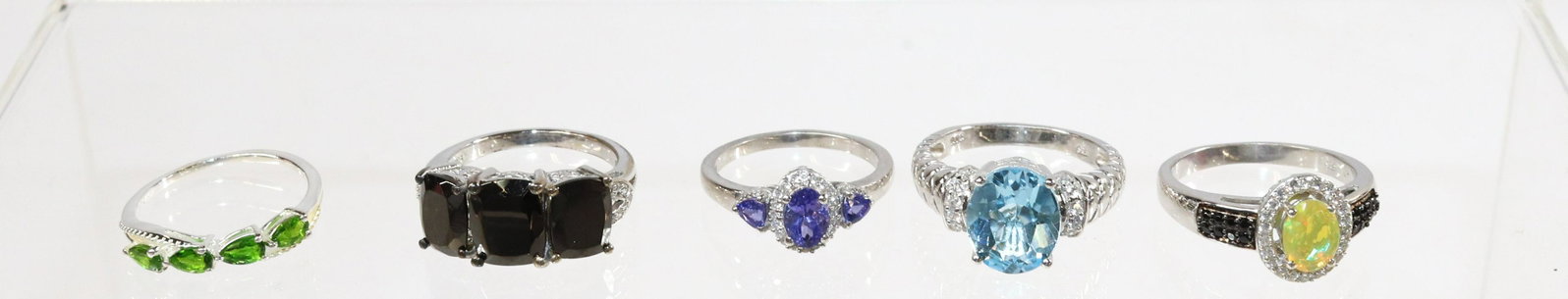 CONTEMPORARY STERLING SILVER RING LOT: 5 RINGS- TANZANITE, OPAL, ONYX, BLUE TOPAZ, BLUE TOPAZ, EMERALD SPINEL SIZE: SIZE- 8,10(4)