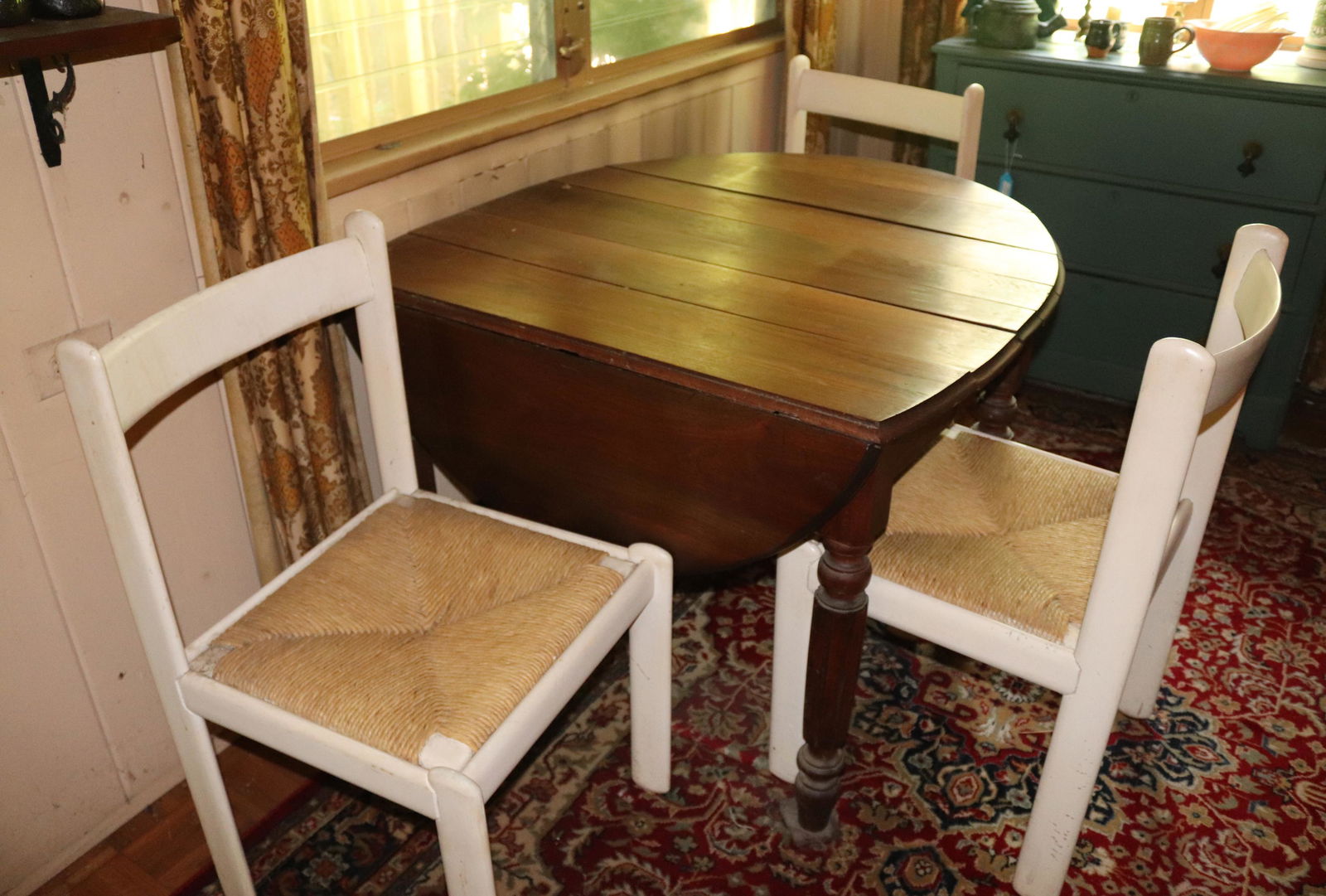 BREAKFAST TABLE AND CHAIRS SET: DROP LEAF TABLE WITH (3) PAINTED CHAIRS AND RUSCH SEATS DISCLAIMER: Pick up DATE: Saturday, July 17 from 10am to 2pm at the address of 161 Raritan River Rd, Califon, NJ