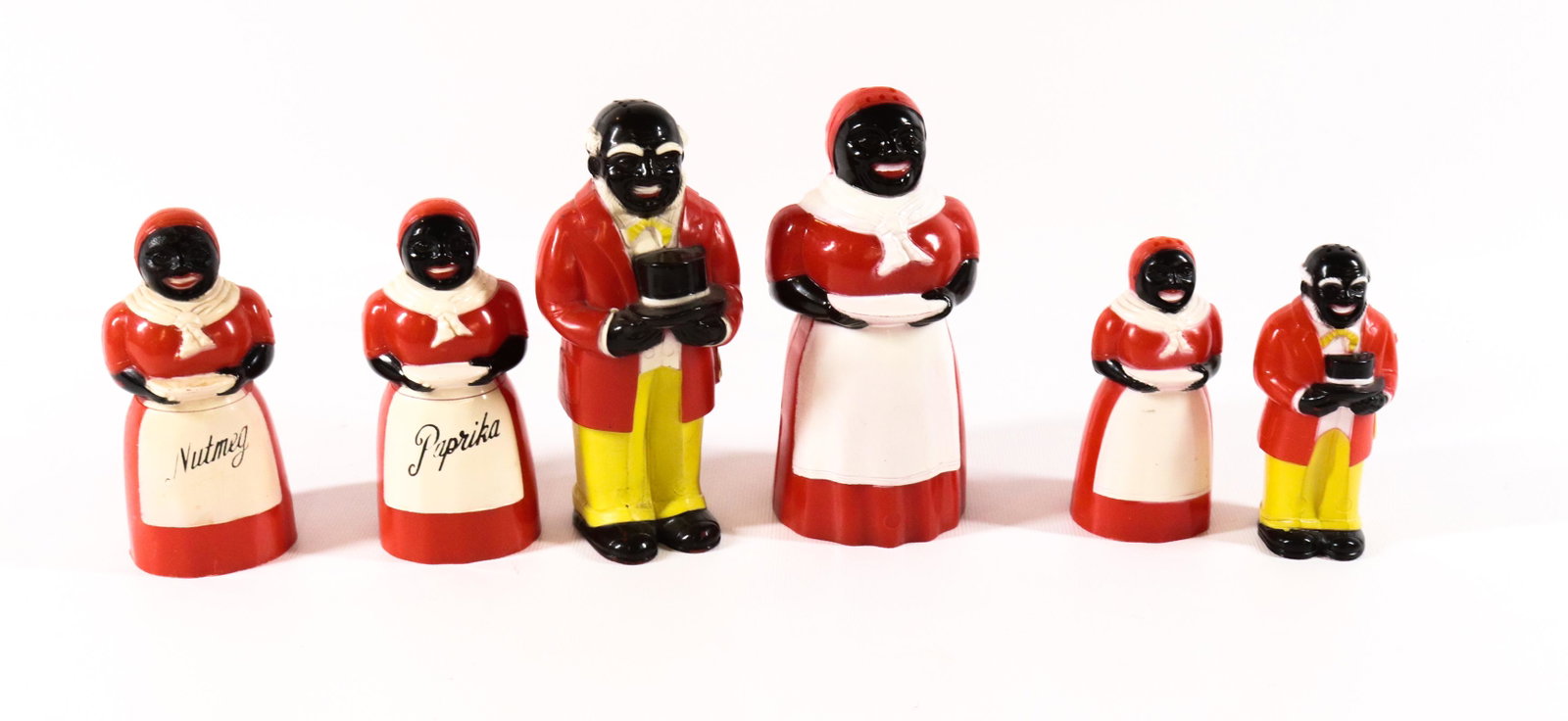 GROUP LOT OF BLACK AMERICANA SPICE CONTAINERS: (6) MOLDED PLASTIC CONTAINERS INCLUDING - UNCLE MOSE AND AUNT JEMIMA SALT AND PEPPER, SMALLER VERSION, PAPRIKA, AND NUTMEG Dimensions 3 1/2" TO 5" H PLEASE READ BEFORE BIDDING – PICKUP FOR THIS 