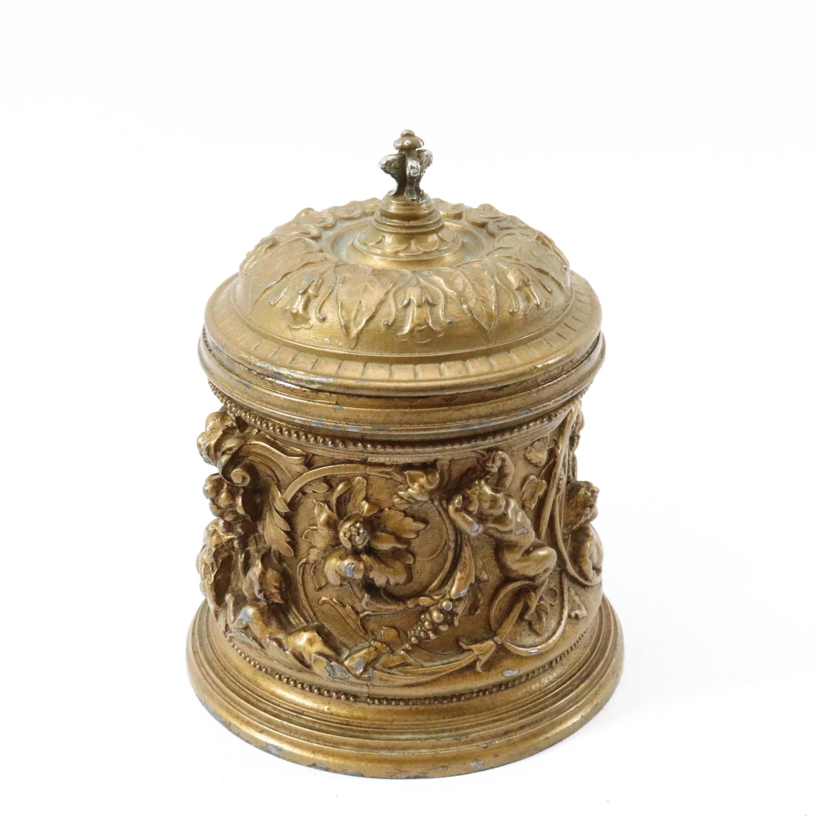 ORNATE METAL TOBACCO BOX: PAINTED SURFACE. DEPICTS CHERUBS AND "DEVIL" FACE Dimensions 6" H PLEASE READ BEFORE BIDDING – PICKUP FOR THIS AUCTION WILL NOT BE UNTIL THE WEEK OF OCTOBER 25TH. PICK-UP WILL BE FROM 9:00AM TIL