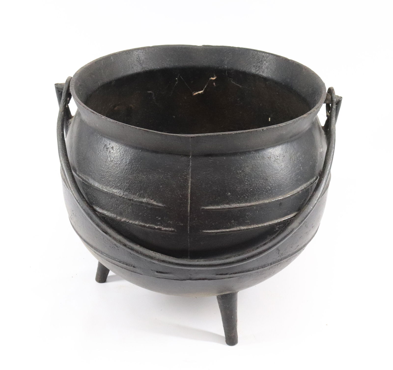 CAST IRON CAULDRON: UNMARKED. WITH HANDLE Dimensions 11" X 11" X 11" PLEASE READ BEFORE BIDDING – PICKUP FOR THIS AUCTION WILL NOT BE UNTIL THE WEEK OF OCTOBER 25TH. PICK-UP WILL BE FROM 9:00AM TILL 4:00PM –