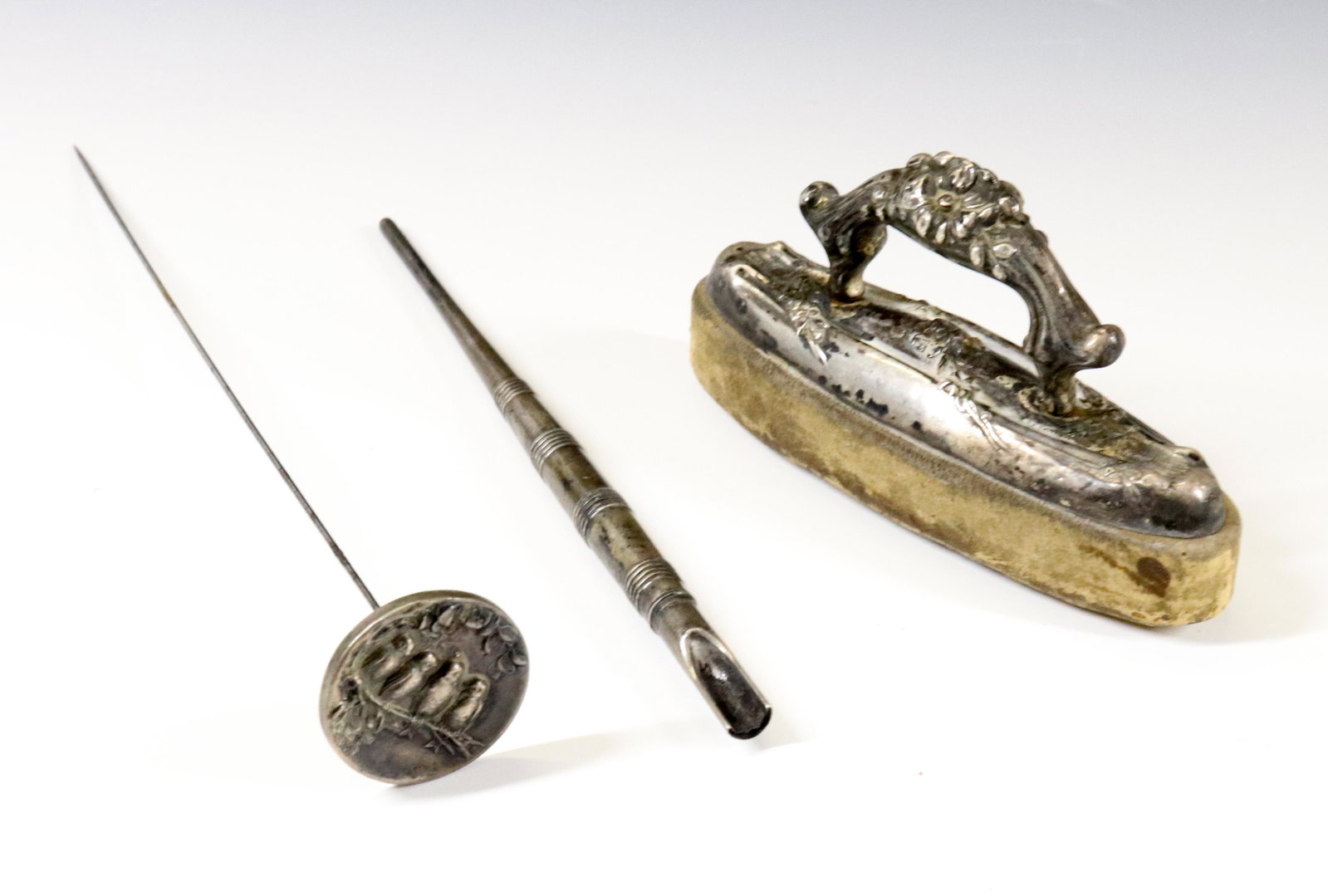 STERLING SILVER GROUPING: GORHAM DIPPER, NAIL BUFFER, AND UNGER BROS. HAT PIN Dimensions 6" - 7 3/4" - 4" PLEASE READ BEFORE BIDDING – PICKUP FOR THIS AUCTION WILL NOT BE UNTIL THE WEEK OF OCTOBER 25TH. PICK-UP WILL BE F
