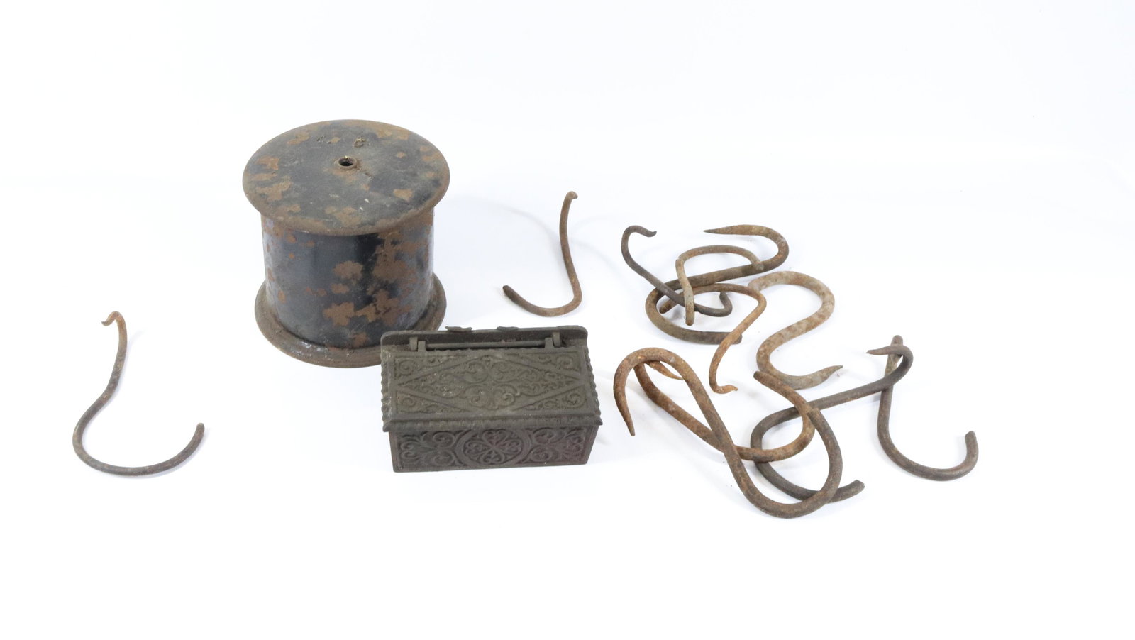 ANTIQUE CAST IRON LOT: LIFT LID MATCH BOX HOLDER, (11) HEAT HOOKS, AND CAST IRON STRING HOLDER Dimensions STRING HOLDER 4 3/4" X 5" PLEASE READ BEFORE BIDDING – PICKUP FOR THIS AUCTION WILL NOT BE UNTIL THE WEEK OF OC