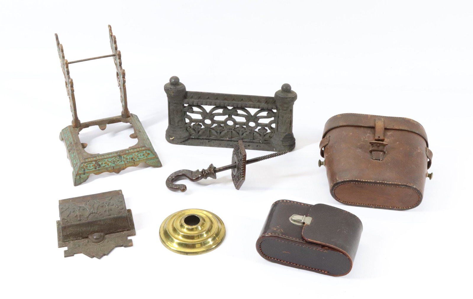 CAST IRON AND LEATHER LOT: INKWELL BASE, CEILING HOOK, MATCH SAFE, FOOT SCRAPER, AND MORE Dimensions INKWELL BASE 5 1/2" X 6" - BOOT SCRAPER 4" X 7" PLEASE READ BEFORE BIDDING – PICKUP FOR THIS AUCTION WILL NOT BE UNTIL T