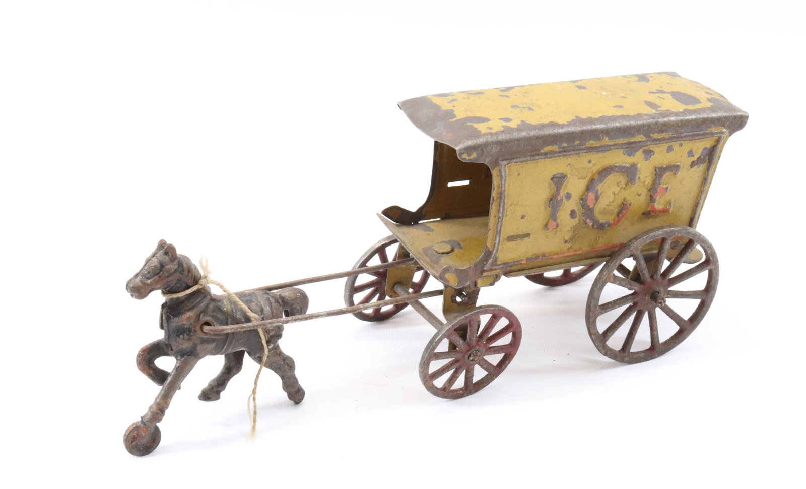 ANTIQUE CAST IRON/TIN ICE WAGON: CAST IRON HORSE PULLING PAINTED TIN WAGON WITH IRON WHEELS Dimensions TOTAL LENGTH 9 1/2" PLEASE READ BEFORE BIDDING – PICKUP FOR THIS AUCTION WILL NOT BE UNTIL THE WEEK OF OCTOBER 25TH. PICK-UP