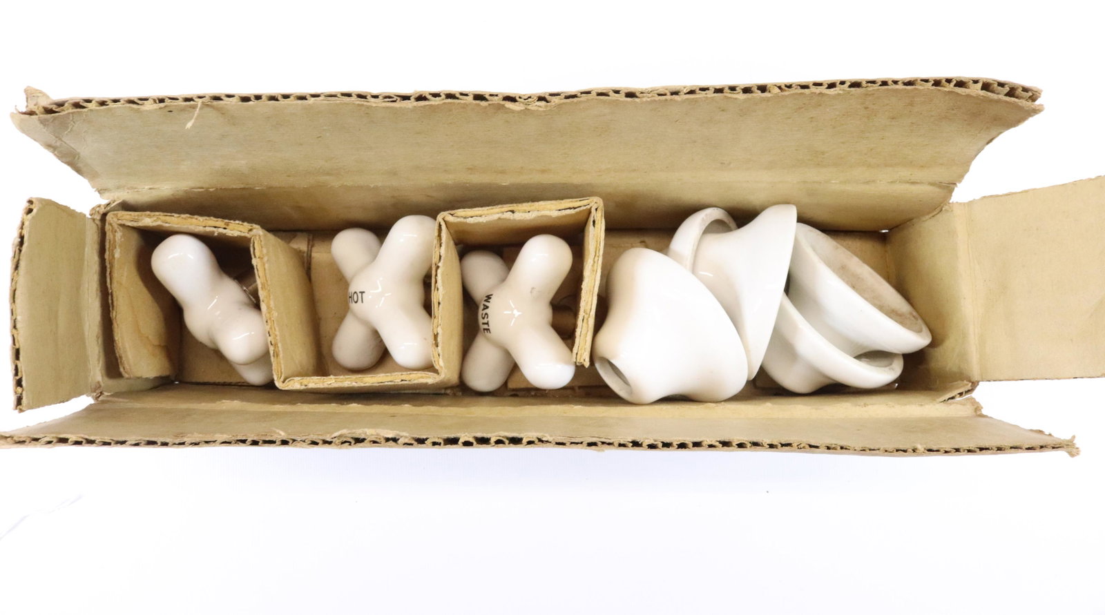 PORCELAIN BATHTUB HARDWARE: NOS IN ORIGINAL BOX. HOT/COLD/WASTE. MADE BY MITCHELL-BISSELL CO. Dimensions KNOBS 3 1/4" D PLEASE READ BEFORE BIDDING – PICKUP FOR THIS AUCTION WILL NOT BE UNTIL THE WEEK OF OCTOBER 25TH. PICK-