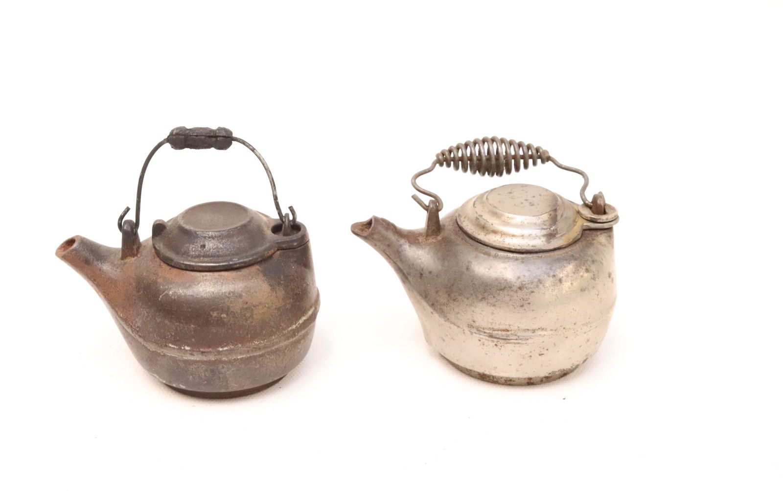 TWO CAST IRON MINIATURE TEA KETTLES (1 of 4)