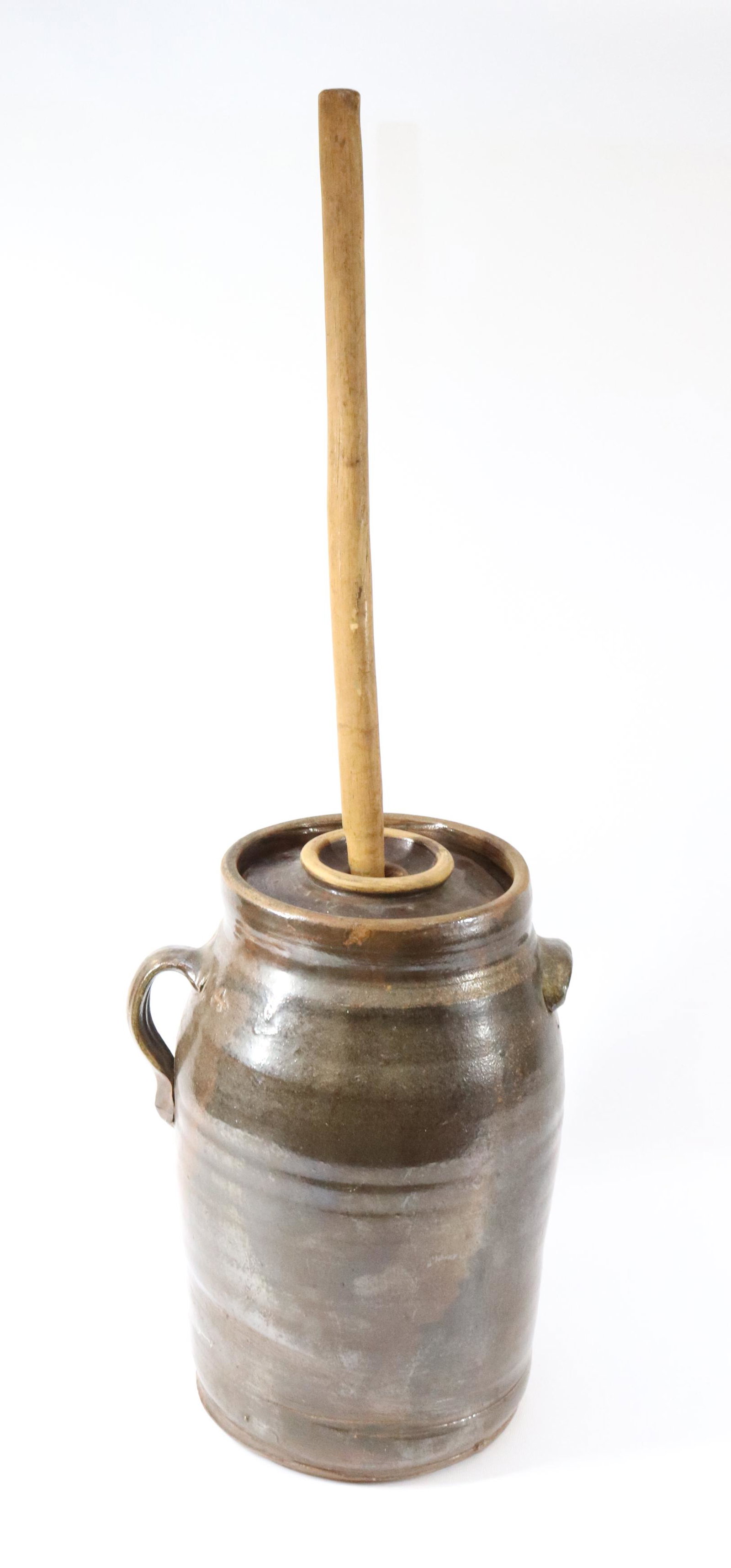 STONEWARE BUTTER CHURN: FOUR GALLON WITH BROWN GLAZE. WOODEN STOMPER PRESENT Dimensions 15" X 8" PLEASE READ BEFORE BIDDING – PICKUP FOR THIS AUCTION WILL NOT BE UNTIL THE WEEK OF OCTOBER 25TH. PICK-UP WILL BE FROM 9:0