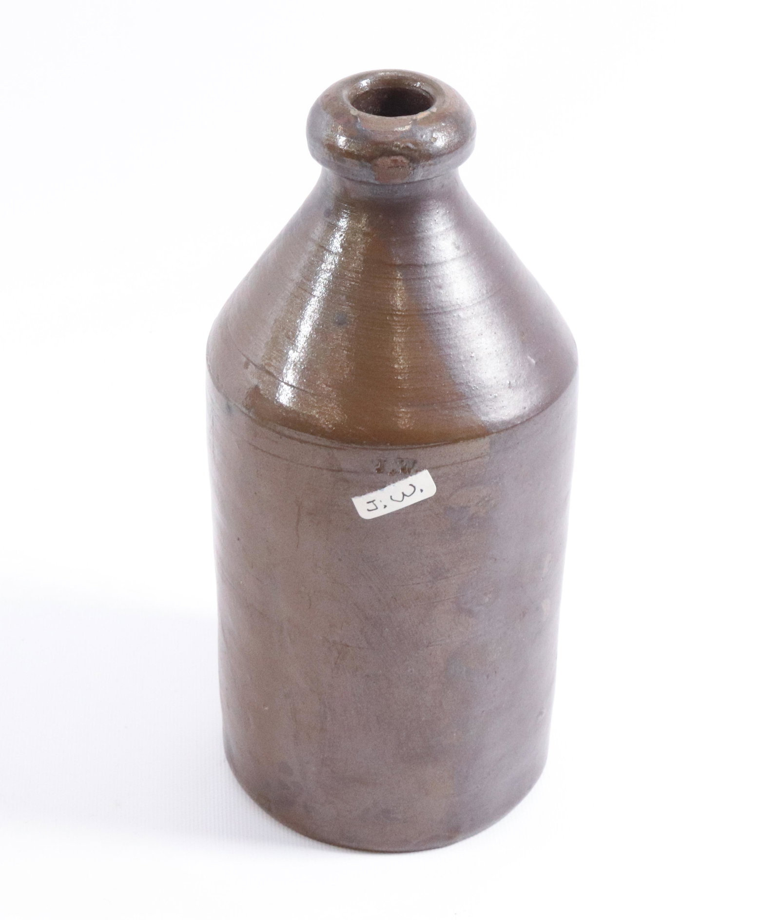 STONEWARE BOTTLE: IMPRESSED J.W. Dimensions 8 3/4" H PLEASE READ BEFORE BIDDING – PICKUP FOR THIS AUCTION WILL NOT BE UNTIL THE WEEK OF OCTOBER 25TH. PICK-UP WILL BE FROM 9:00AM TILL 4:00PM – YOU MUST MAKE 