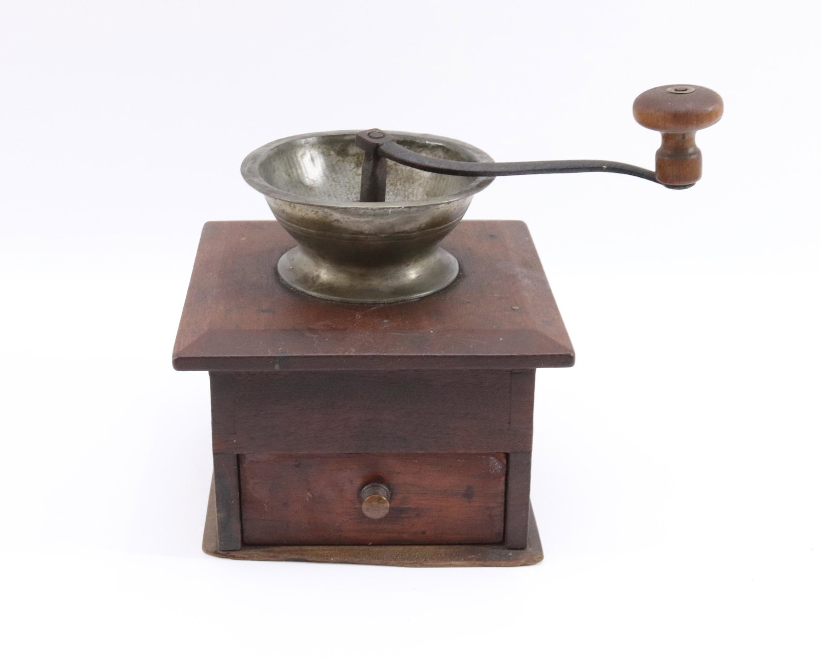 WOOD AND PEWTER COFFEE GRINDER: DOVETAILED CONSTRUCTION BODY WITH SINGLE DRAWER Dimensions 7" X 7" X7" PLEASE READ BEFORE BIDDING – PICKUP FOR THIS AUCTION WILL NOT BE UNTIL THE WEEK OF OCTOBER 25TH. PICK-UP WILL BE FROM 9:00A