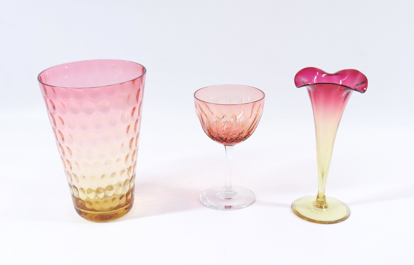 AMBERINA ART GLASS GROUP LOT: "BEAKER" VASE WITH FUCHSIA RIM AND CUT WINE WITH COLOR SIZE: 4 3/4" TO 6" PLEASE READ BEFORE BIDDING – PICKUP FOR THIS AUCTION WILL NOT BE UNTIL THE WEEK OF OCTOBER 25TH. PICK-UP WILL BE FROM 9:00AM