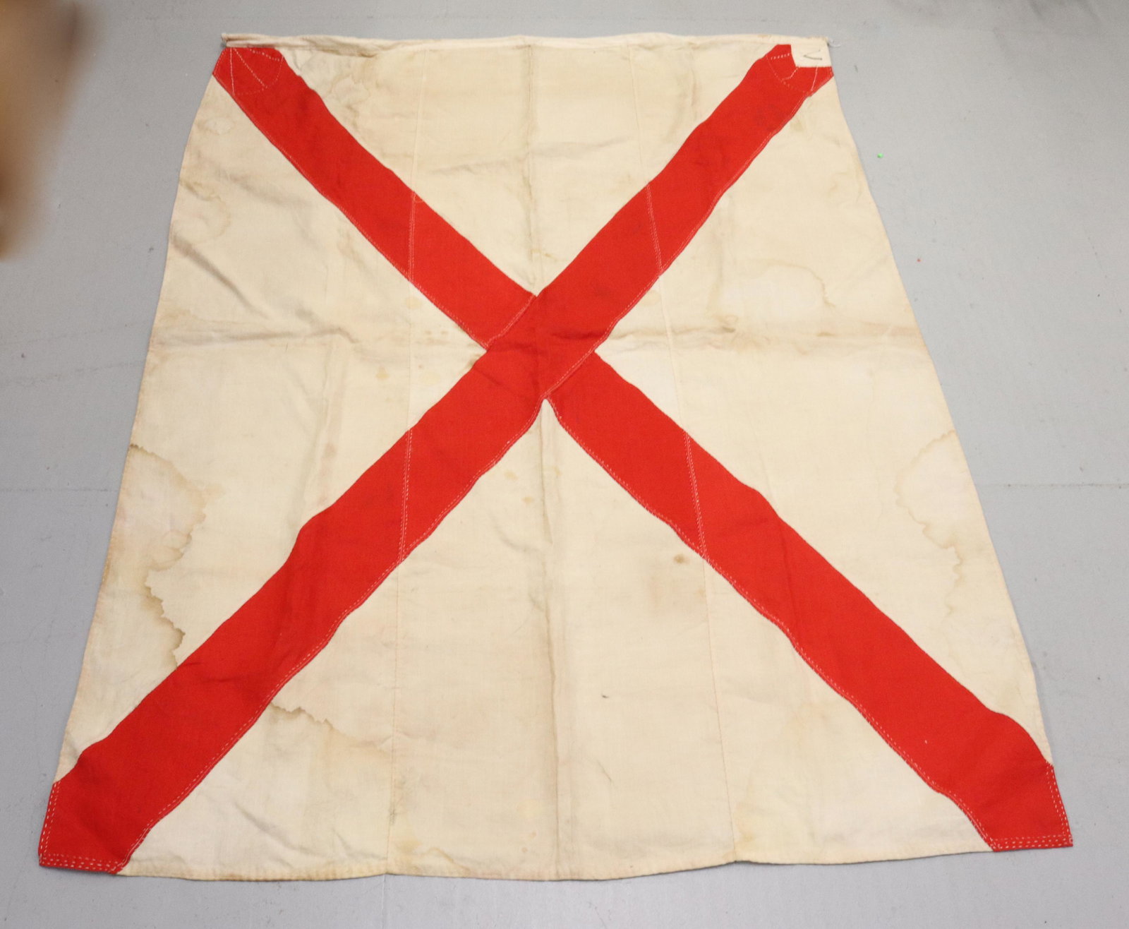 ALABAMA STATE FLAG: MARKED WITH A "V" IN THE CORNER - MACHINE AND HAND STITCHING SIZE: 50" X 67" PLEASE READ BEFORE BIDDING – PICKUP FOR THIS AUCTION WILL NOT BE UNTIL THE WEEK OF OCTOBER 25TH. PICK-UP WILL BE FROM 9:0