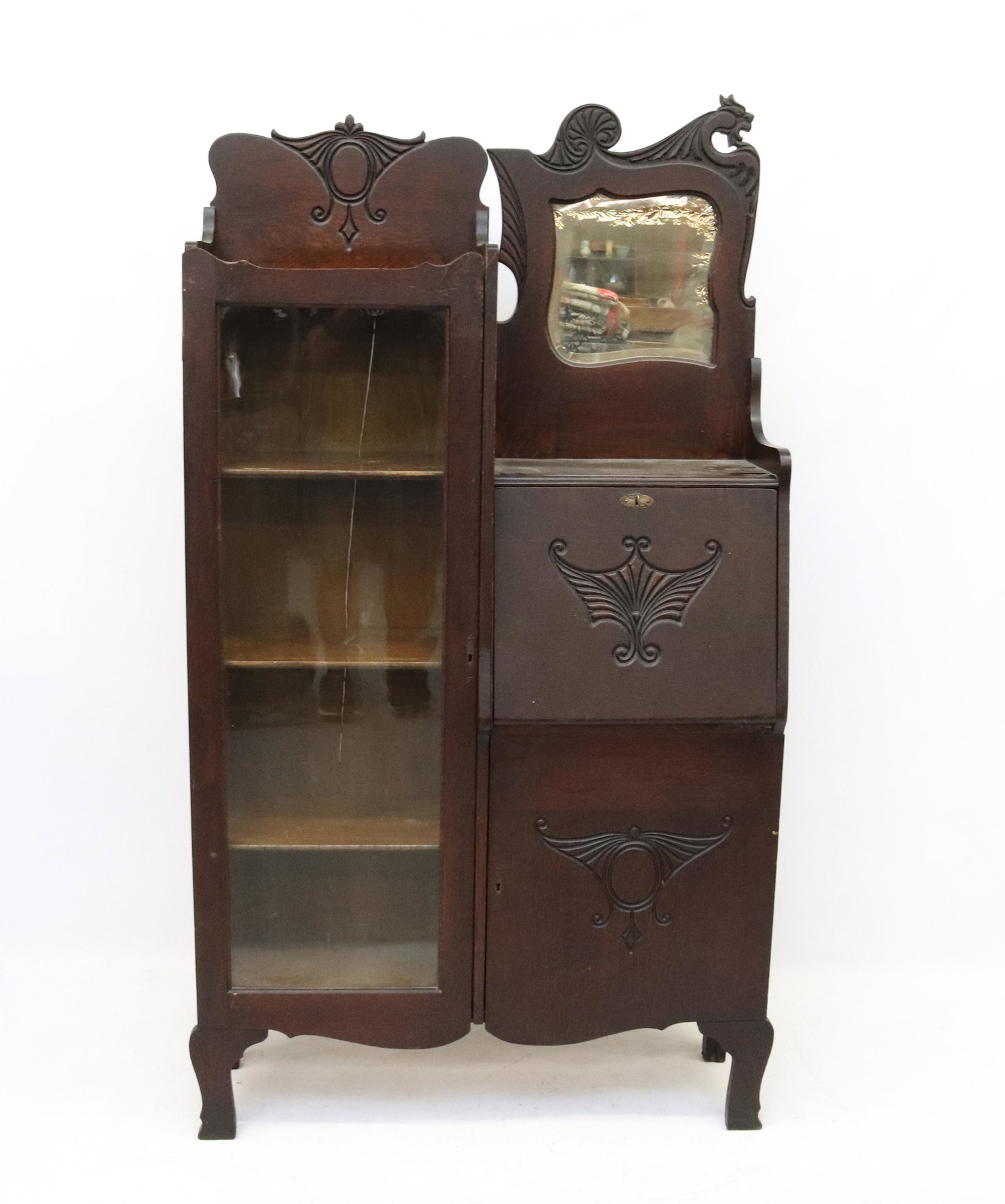 OAK SIDE-BY-SIDE CABINET: DARK FINISH. GLASS FRONT BOOKCASE ASIDE OF DROP FRONT DESK OVER ONE DOOR. ART NOUVEAU STYLE SIZE: 69" X 37 1/2" X 12" PLEASE READ BEFORE BIDDING – PICKUP FOR THIS AUCTION WILL NOT BE UNTIL THE WEEK 