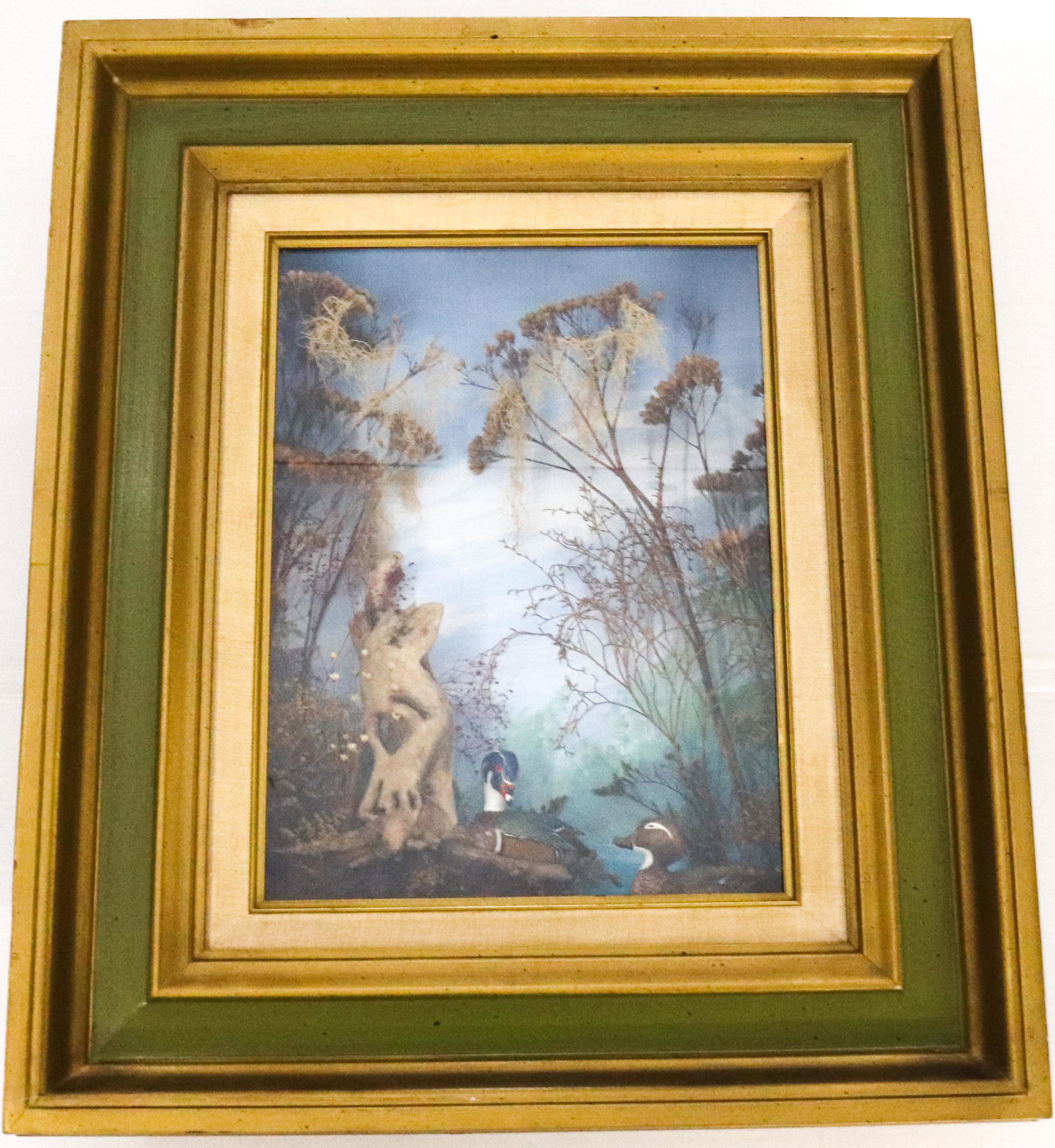 VINTAGE HANGING DUCK DIORAMA: PAINTED INTERIOR BACKING WITH CARVED,PAINTED DUCKS AND DRIED FLOWERS. ENCLOSED IN SHADOW BOX SIZE: 19 1/4" X 16 1/2" TOTAL SIZE