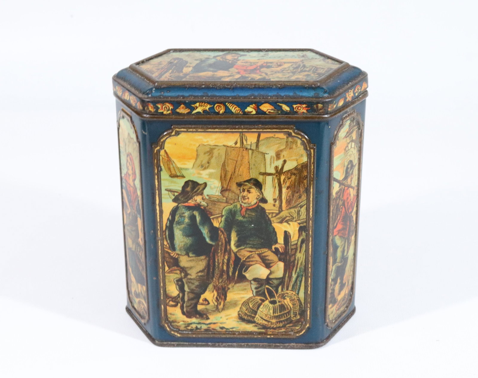 HUNTLEY & PALMERS TIN LITHO BISCUIT TIN: SIX-SIDED COMMERCIAL FISHERMEN MOTIF. CA. 1892 6 1/4" X 5 1/2" X 3 1/2"
