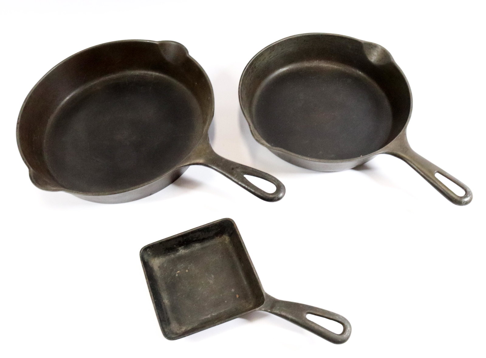 (2) GRISWOLD AND ERIE CAST IRON PANS (1 of 3)