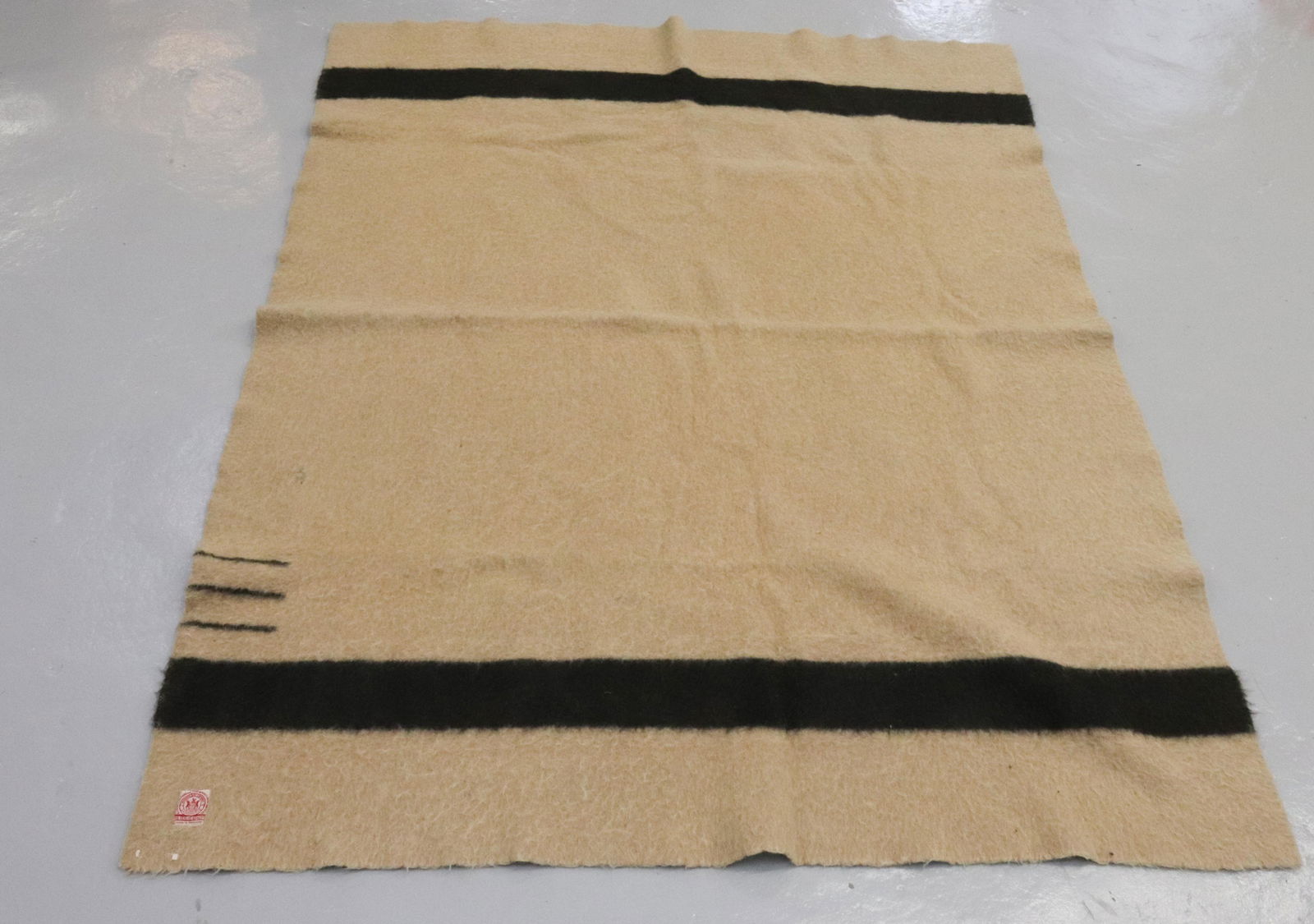 VINTAGE HUDSON BAY BLANKET: WOOL WITH BLACK STRIPE...THREE POINT...LABELED MADE IN ENGLAND Dimensions: 56" X 70" Terms: Hartzell's Auction Gallery will handle most of the shipping in-house. WE do reserve the right to not ship so
