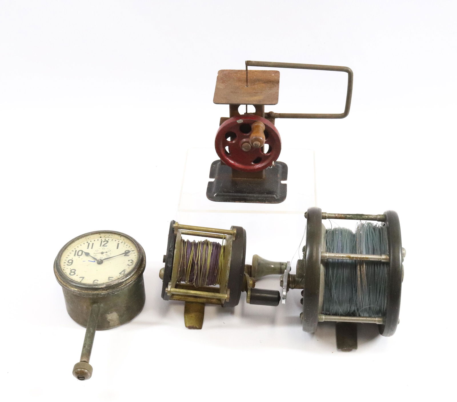 (2) FISHING REELS, HAND CRANK TOY SAW AND CLOCK (1 of 2)