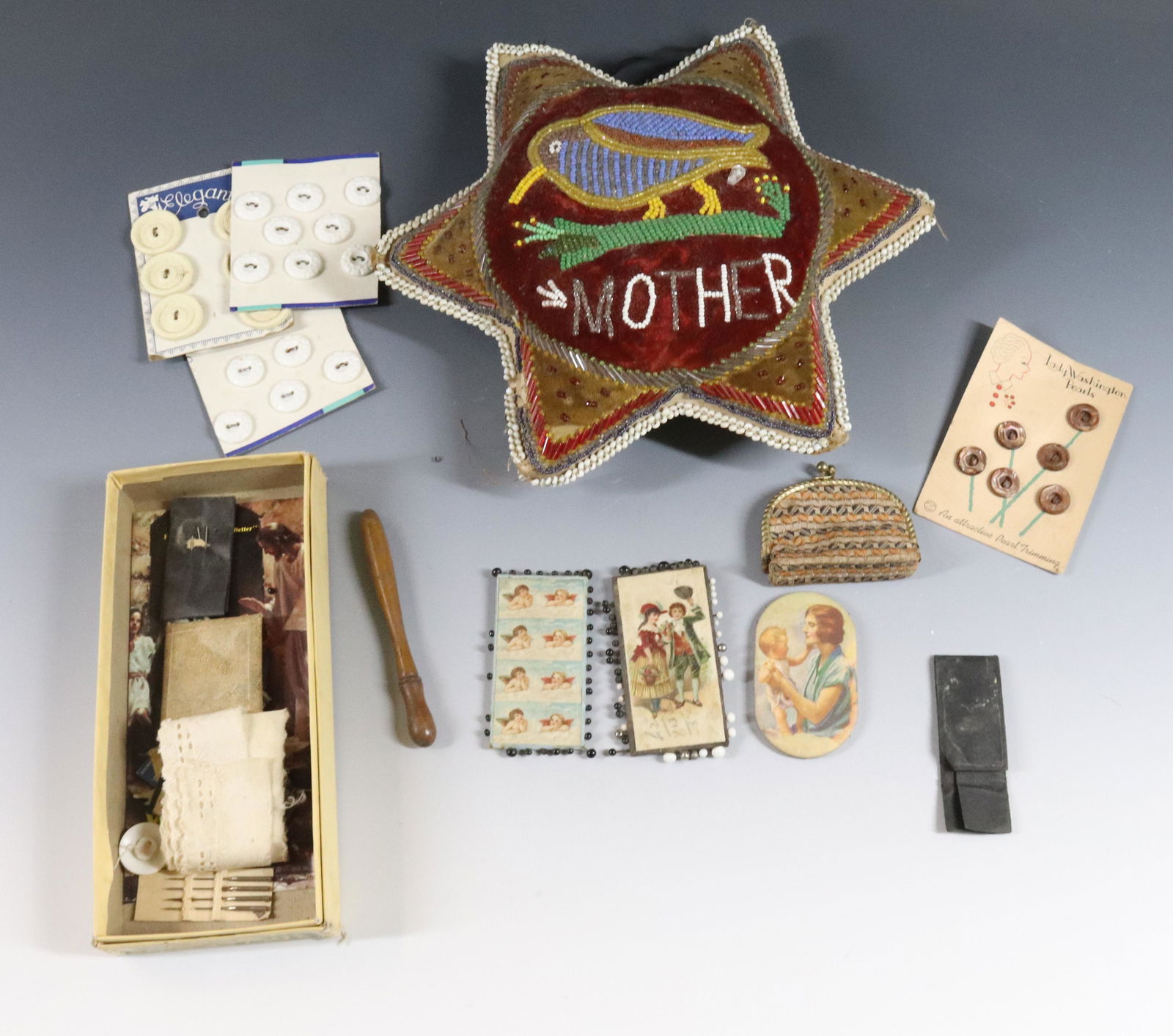 BEADED STAR PINCUSHION: STAR WITH BIRD MOTIF "MOTHER" PLUS BUTTONS, NEEDLE CASES AND MORE Dimensions: STAR 9" ACROSS Terms: Hartzell's Auction Gallery will handle most of the shipping in-house. WE do reserve the right to not
