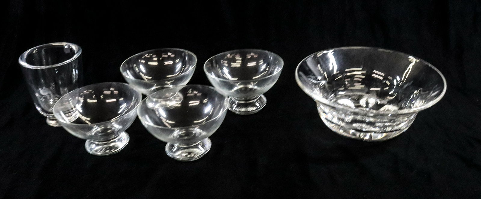 LOT OF CLEAR GLASS ITEMS: ORREFORS BOWL, SM. VASE AND 4 UNSIGNED GLASSES DIMENSIONS:BOWLE 8" x 3" TERMS:Hartzell's Auction Gallery will handle most of the shipping in-house. WE do reserve the right to not ship some large items