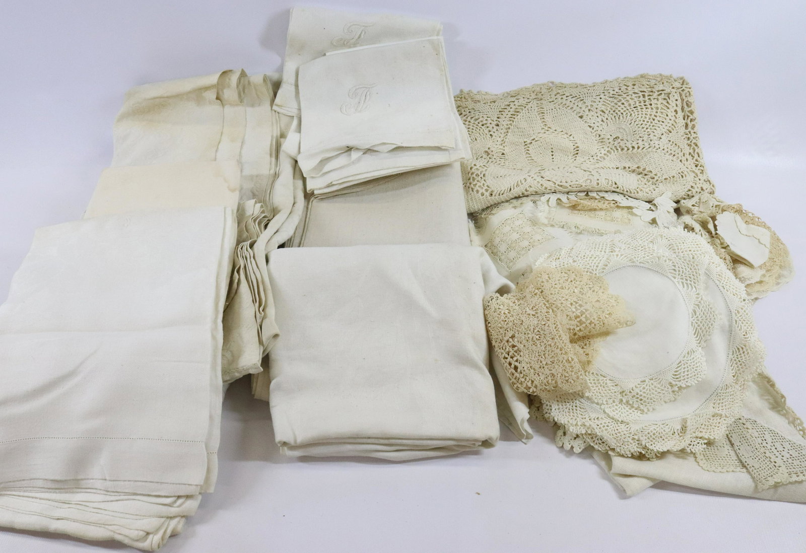 LARGE LOT OF VINTAGE DRYGOODS: INCLUDING: TABLECLOTHS, DOILIES AND MORE TERMS:Hartzell's Auction Gallery will handle most of the shipping in-house. WE do reserve the right to not ship some large items, larger lots of glassware, Fur