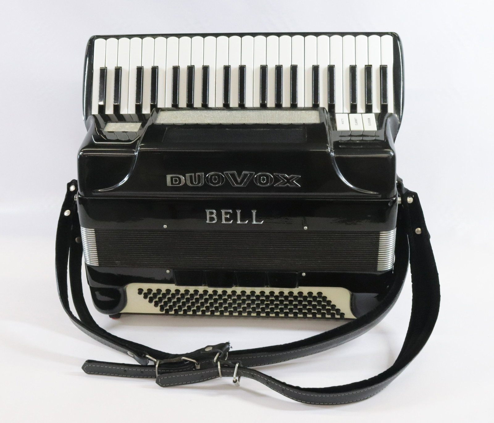 BELL DUOVOX ACCORDION: BELL DUOVOX ACCORDION WITH CASE DIMENSIONS: 23" X 20" X 10" TERMS: Hartzell's Auction Gallery will handle most of the shipping in-house. WE do reserve the right to not ship some large items, larger lo