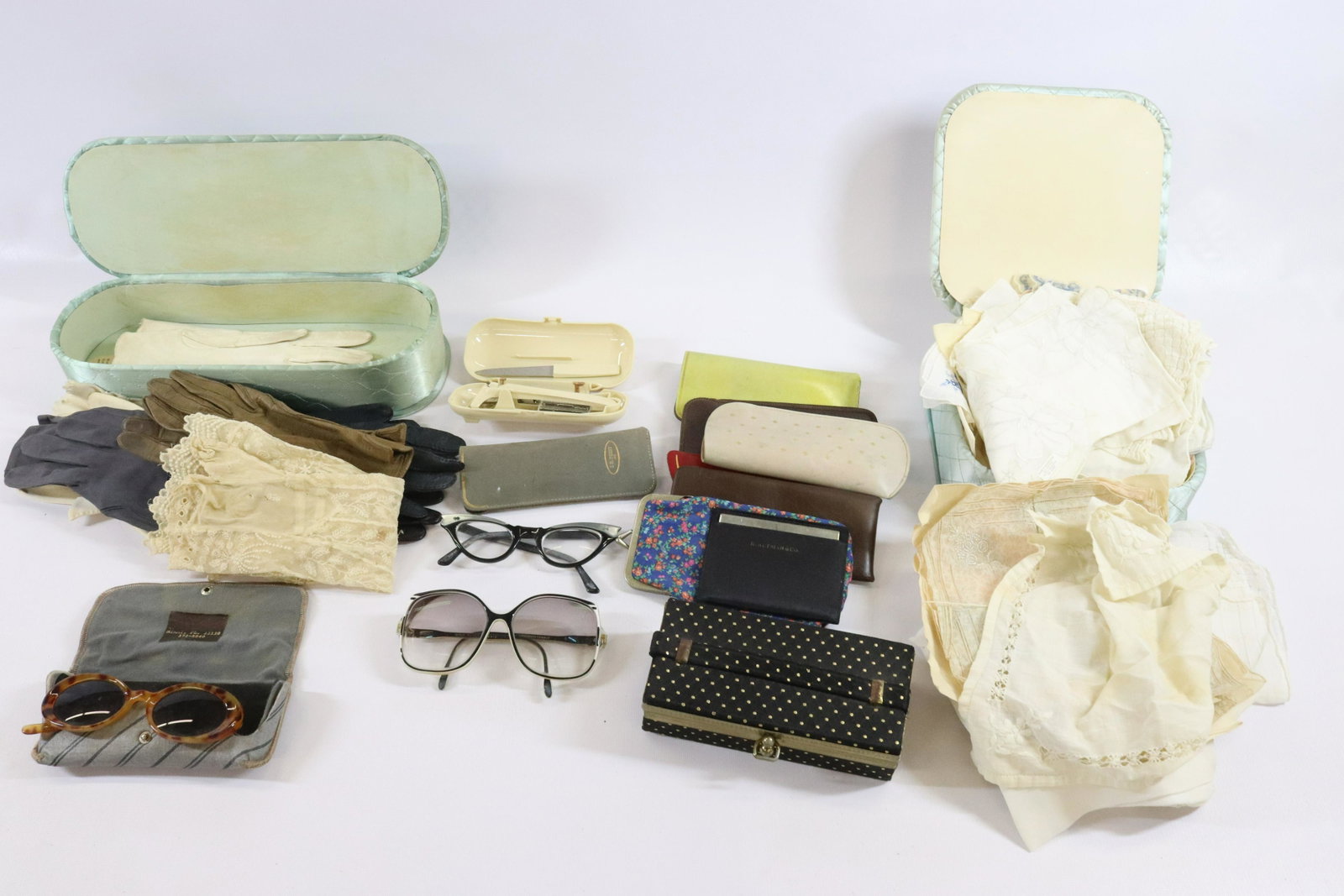 GROUP OF FASHIONABLE ITEMS: HANDMADE HANDKERCHIEFS, EYE GLASSES AND GLOVES TERMS: Hartzell's Auction Gallery will handle most of the shipping in-house. WE do reserve the right to not ship some large items, larger lots of glasswa