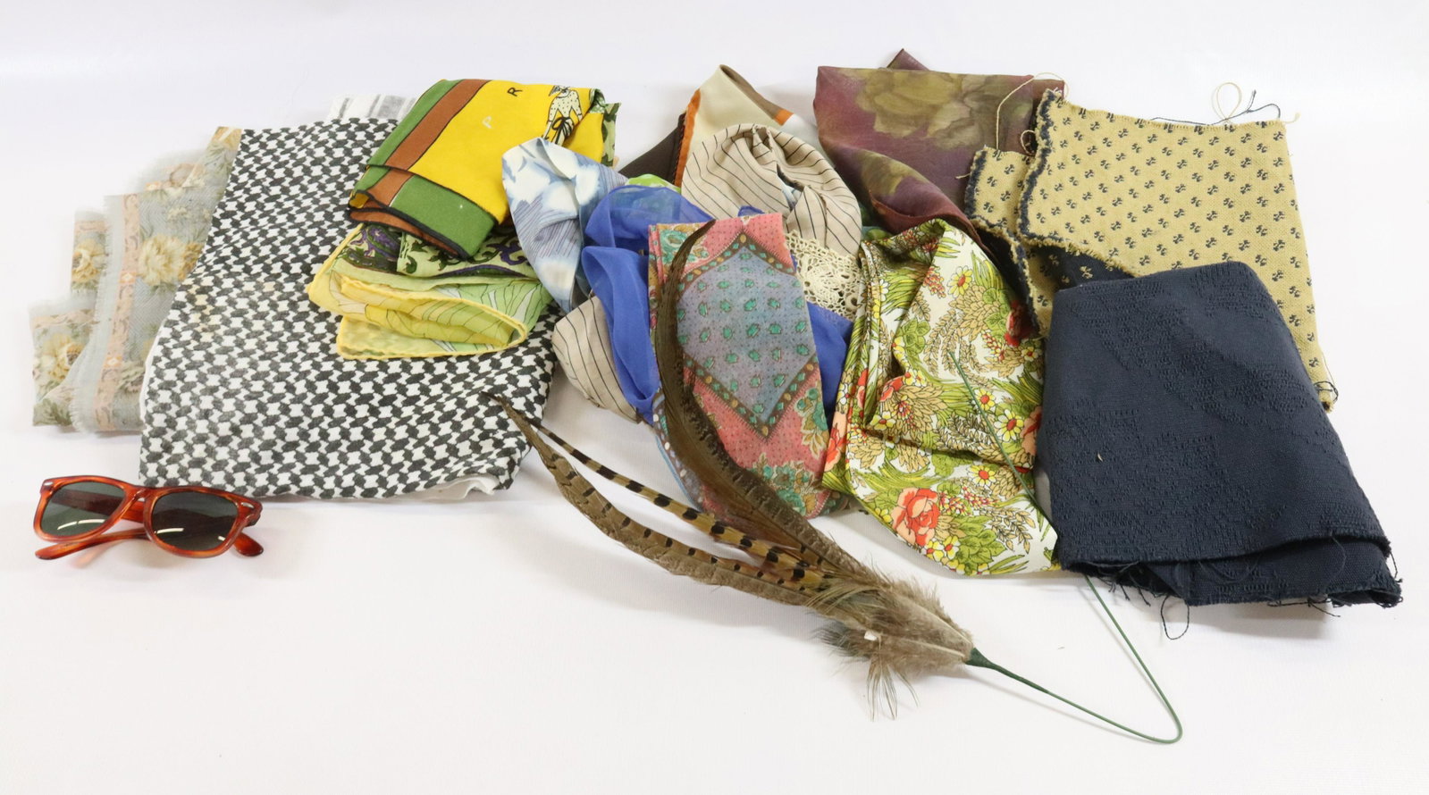 GROUP LOT OF TEXTILES: INCLUDING: SCARVES, SUNGLASSES, MATERIAL AND MORE TERMS: Hartzell's Auction Gallery will handle most of the shipping in-house. WE do reserve the right to not ship some large items, larger lots of glas