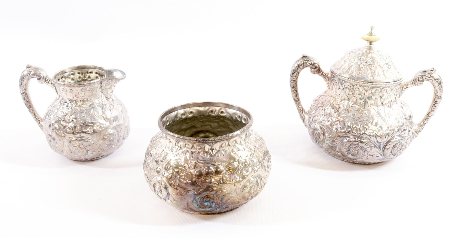 SILVER PLATE REPOUSSE CREAMER AND LIDDED SUGAR: SIMPSON HALL & MILLER 19TH CENTURY 3 PIECES INCLUDES WASTE BOWL PLATING IN VERY GOOD CONDITION TERMS: Hartzell's Auction Gallery will handle most of the shipping in-house. WE do reserve the right to n