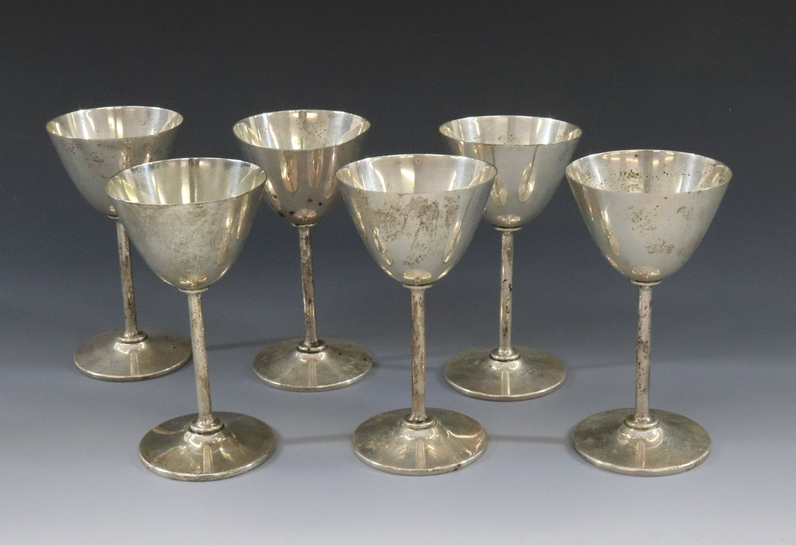 STERLING SILVER WINE GOBLETS: (6) GOBLETS BLACK STARR & FROST ALL WITH MONOGRAM TOTAL WEIGHT 16.67 OZT DIMENSIONS: 5 1/2" X 2 3/4" TERMS: Hartzell's Auction Gallery will handle most of the shipping in-house. WE do reserve the righ