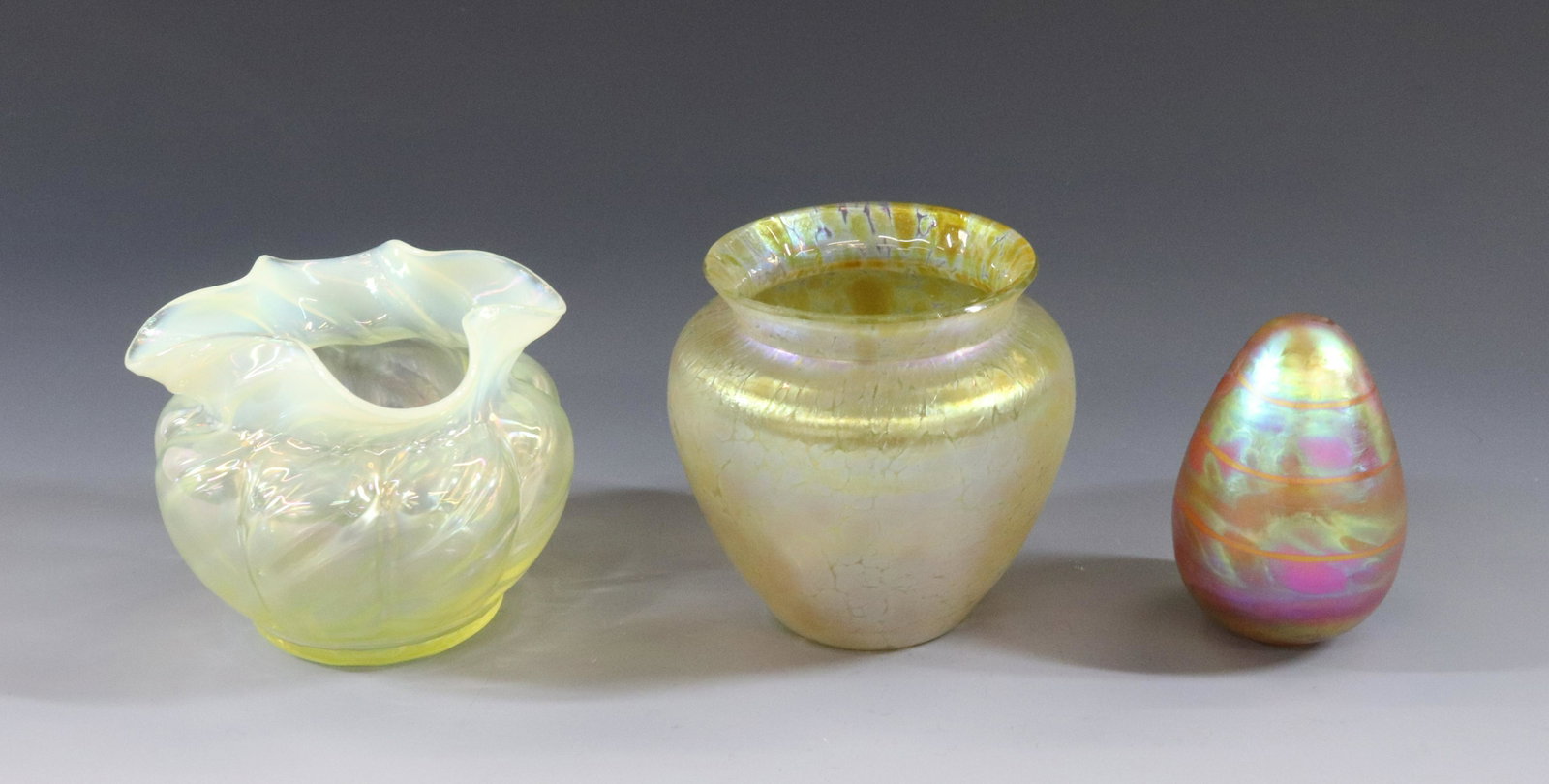 ART GLASS GROUPING: (3) INCLUDES IRIDESCENT EGG AND VASE AND OPAL IRIDESCENT VASE POLISHED PONTIL DIMENSIONS: 3" APPROX TERMS: Hartzell's Auction Gallery will handle most of the shipping in-house. WE do reserve the right