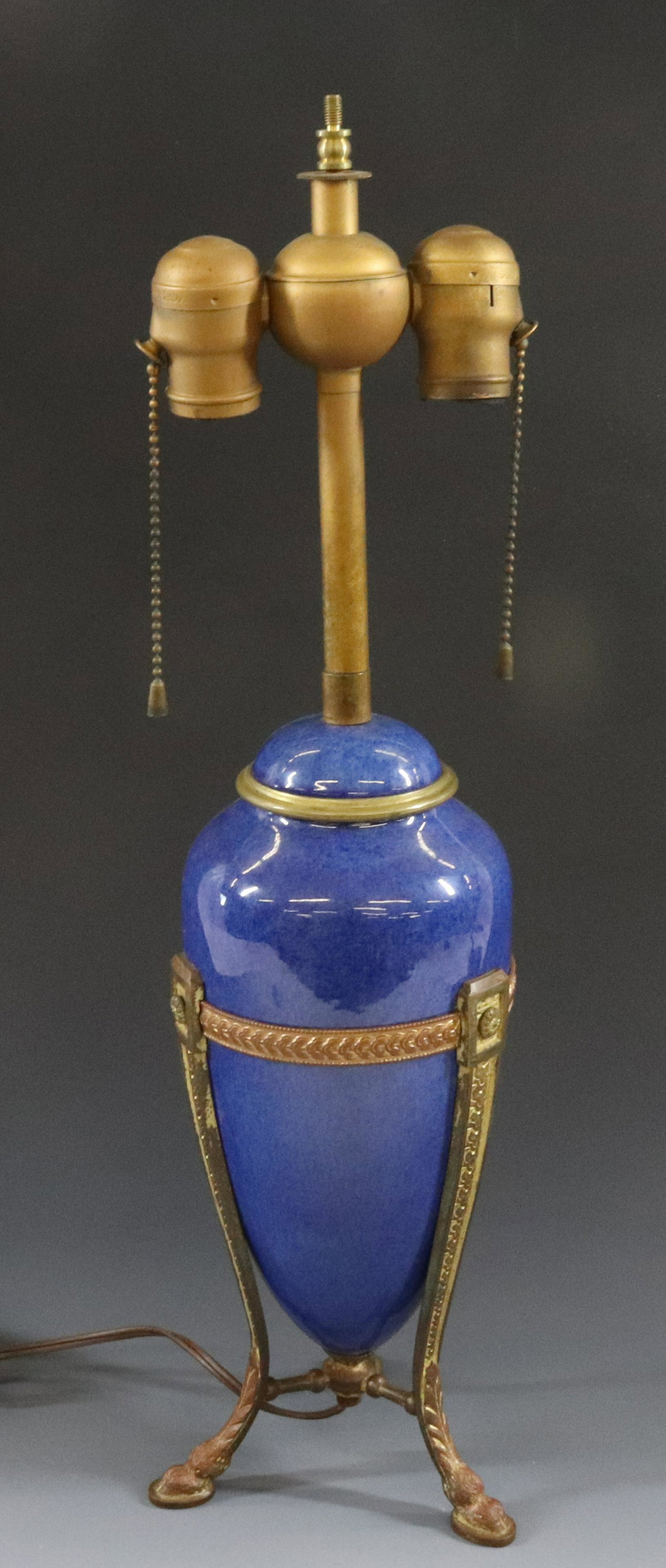 FRENCH BRONZE LAMP: BRONZE FRAME WITH HOOF FEET AND ORIGINAL FIXTURE LAPIS COLOR GLAZE INSERT DIMENSIONS: 21" X 4 3/4" TERMS: Hartzell's Auction Gallery will handle most of the shipping in-house. WE do reserve the right 