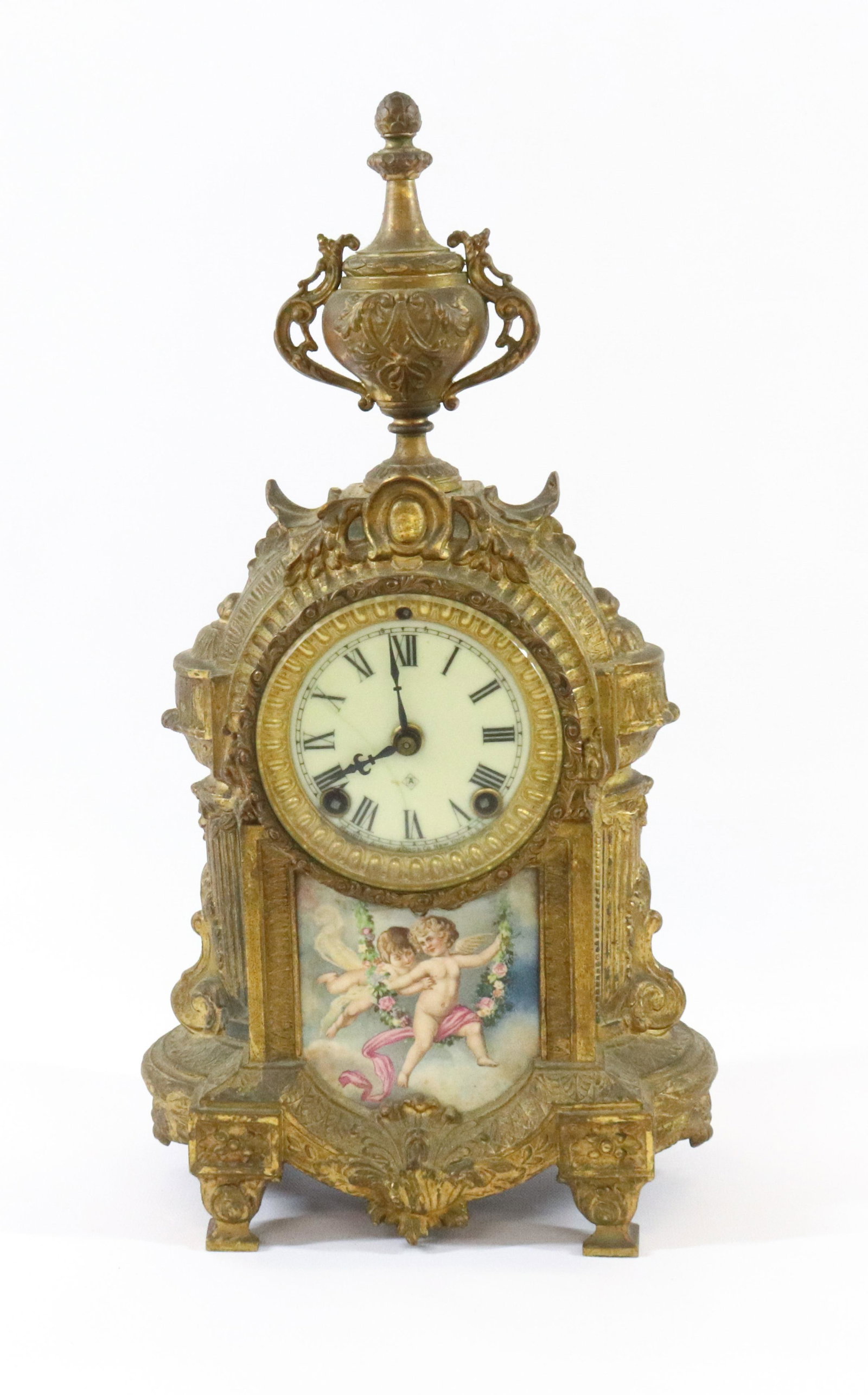 ANSONIA FRENCH STYLE CLOCK: WITH VERSAILLES TRANSFER PORCELAIN PLAQUE SPELTER METAL WITH GOLD PAINT DIMENSIONS: 15 1/2" X 8" TERMS: Hartzell's Auction Gallery will handle most of the shipping in-house. WE do reserve the right to