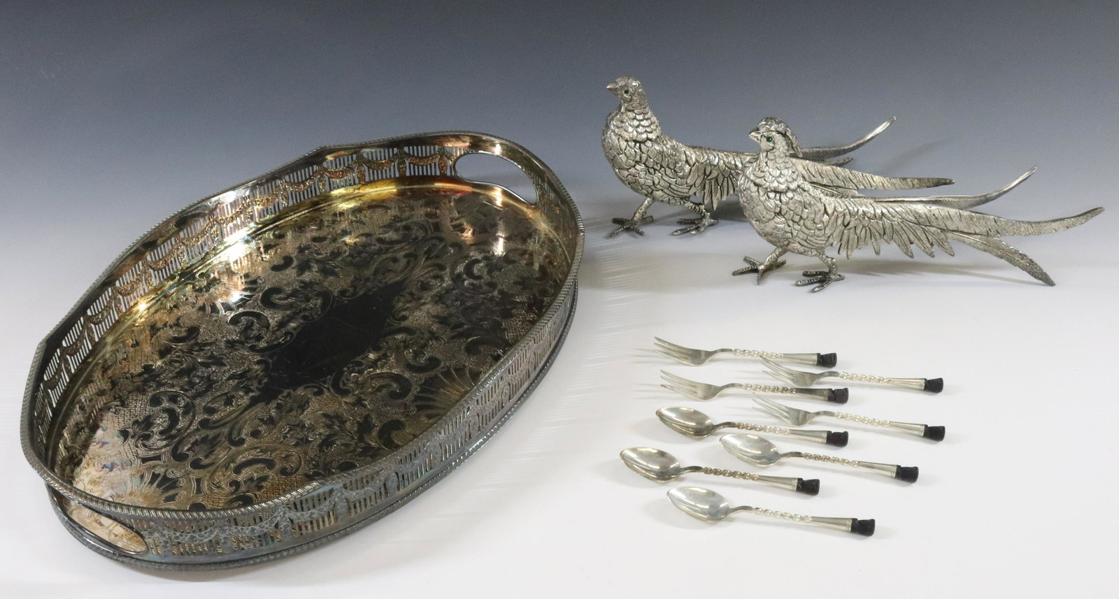 SILVER PLATE TRAY GROUPING: (3) OVAL GALLERIED TRAY SHEFFIELD ENGLAND, PAIR OF PHEASANTS CENTERPIECE AND SET OF 8 DESSERT FORKS AND SPOONS DIMENSIONS: 2 1/4"H X 16" X 11" PHEASANTS 11" TERMS: Hartzell's Auction Gallery will hand
