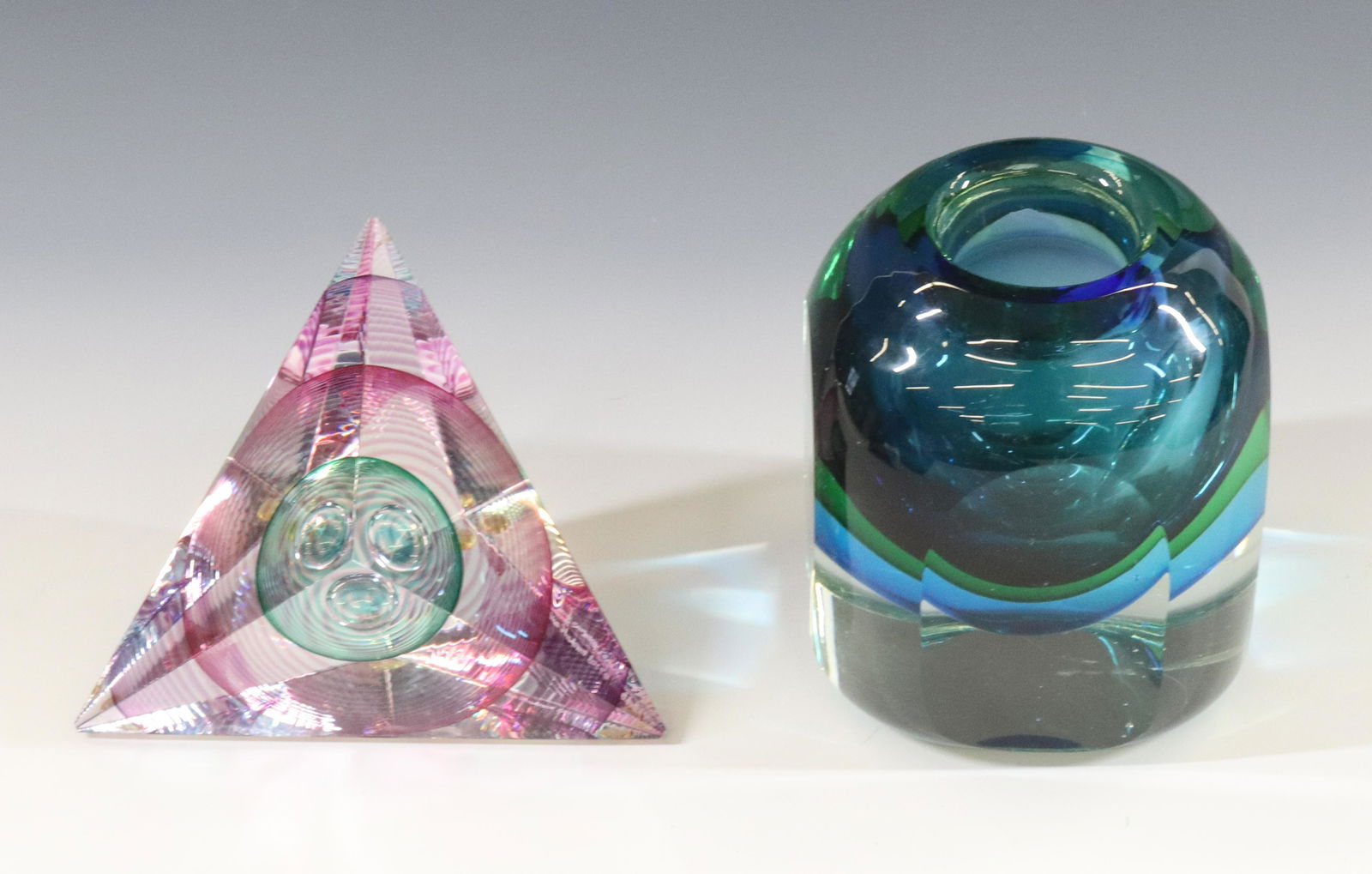 ITALIAN MODERN VASE: TEAL GREEN AND BLUE IN FLATTENED CUT SIDE VASE AND GEOMETRIC PAPERWEIGHT SIGNED KIT KARBLER & MICHAEL DAVID #89103 DIMENSIONS: 4 1/2"H X 3 1/2", 3 1/2"H X 5" TERMS: Hartzell's Auction Gallery will han