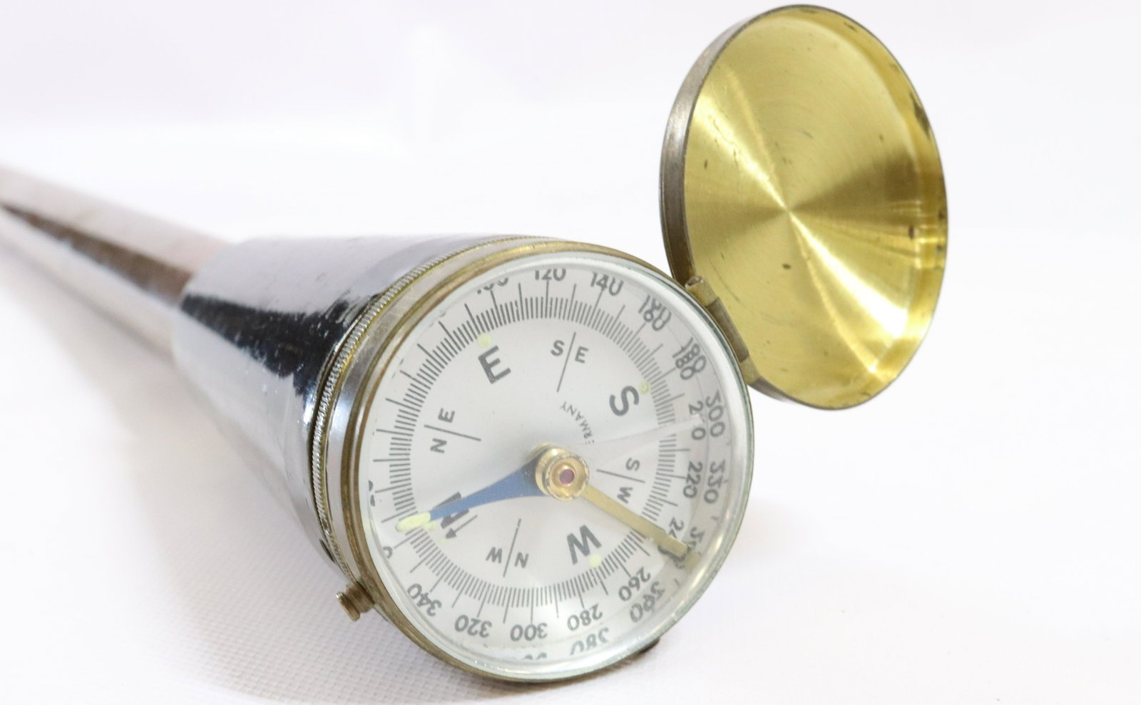 ANTIQUE GERMAN GADGET CANE: BRASS SHAFTED CANE WITH REMOVABLE COMPASS AND MICROSCOPE. COMPASS MRKD. GERMANY DIMENSIONS: 36" L TERMS: Hartzell's Auction Gallery will handle most of the shipping in-house. WE do reserve the right t
