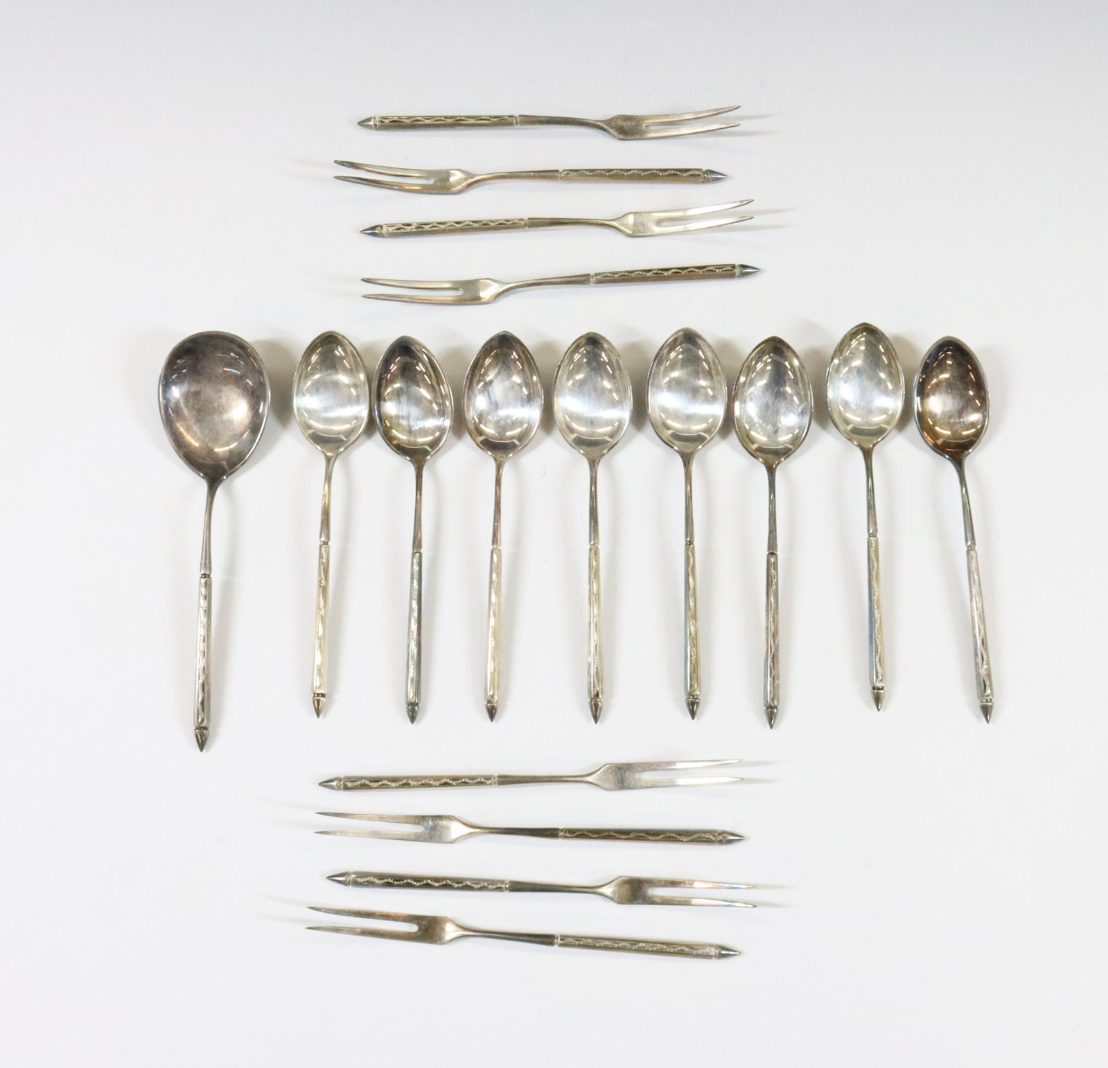 AUSTRIA 800 SILVER FLATWARE: (17) BRIGHT CUT ENGRAVED DEMITASSE EIGHT SPOONS AND FORKS AND SUGAR SPOON HALLMARKS TOTAL WEIGHT 5.62 OZT DIMENSIONS: 4"L TERMS: Hartzell's Auction Gallery will handle most of the shipping in-house. W