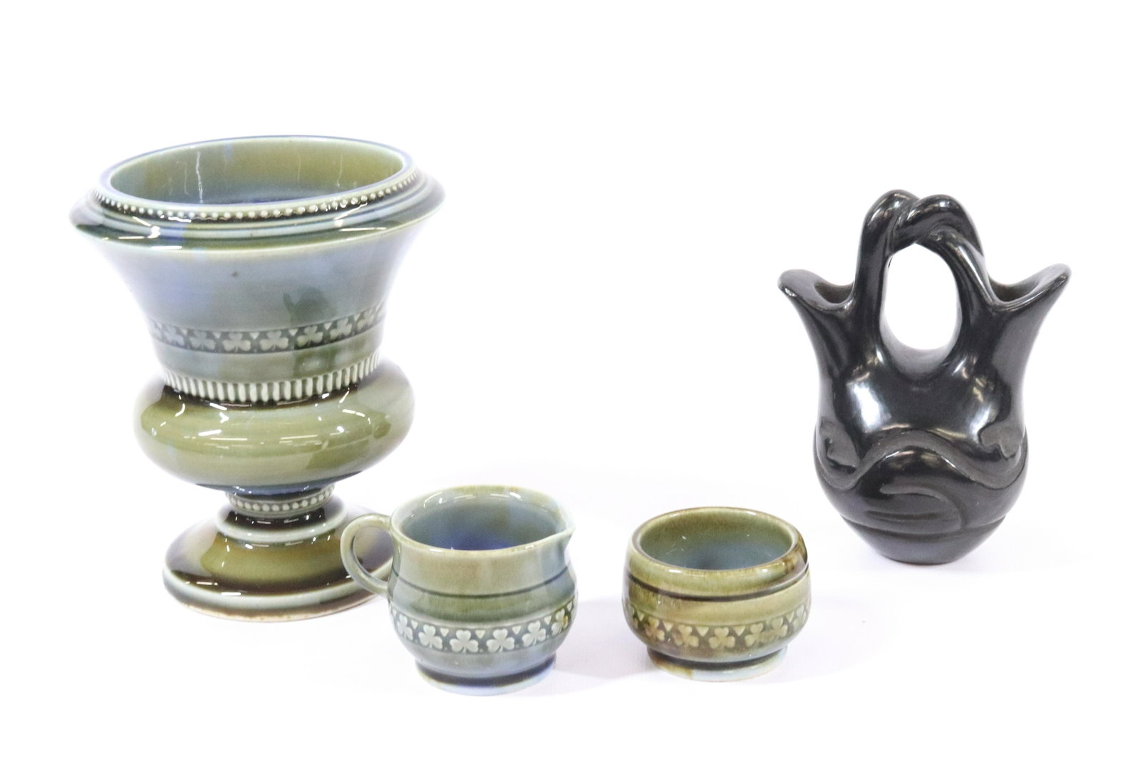 NATIVE AMERICAN WEDDING JUG AND WADE PORCELAIN: (4) SANTA CLARA TWO SPOUT JUG AND WADE URN, SUGAR AND CREAMER DIMENSIONS: JUG 5 1/4"H X 4" URN 6" TERMS: Hartzell's Auction Gallery will handle most of the shipping in-house. WE do reserve the right t