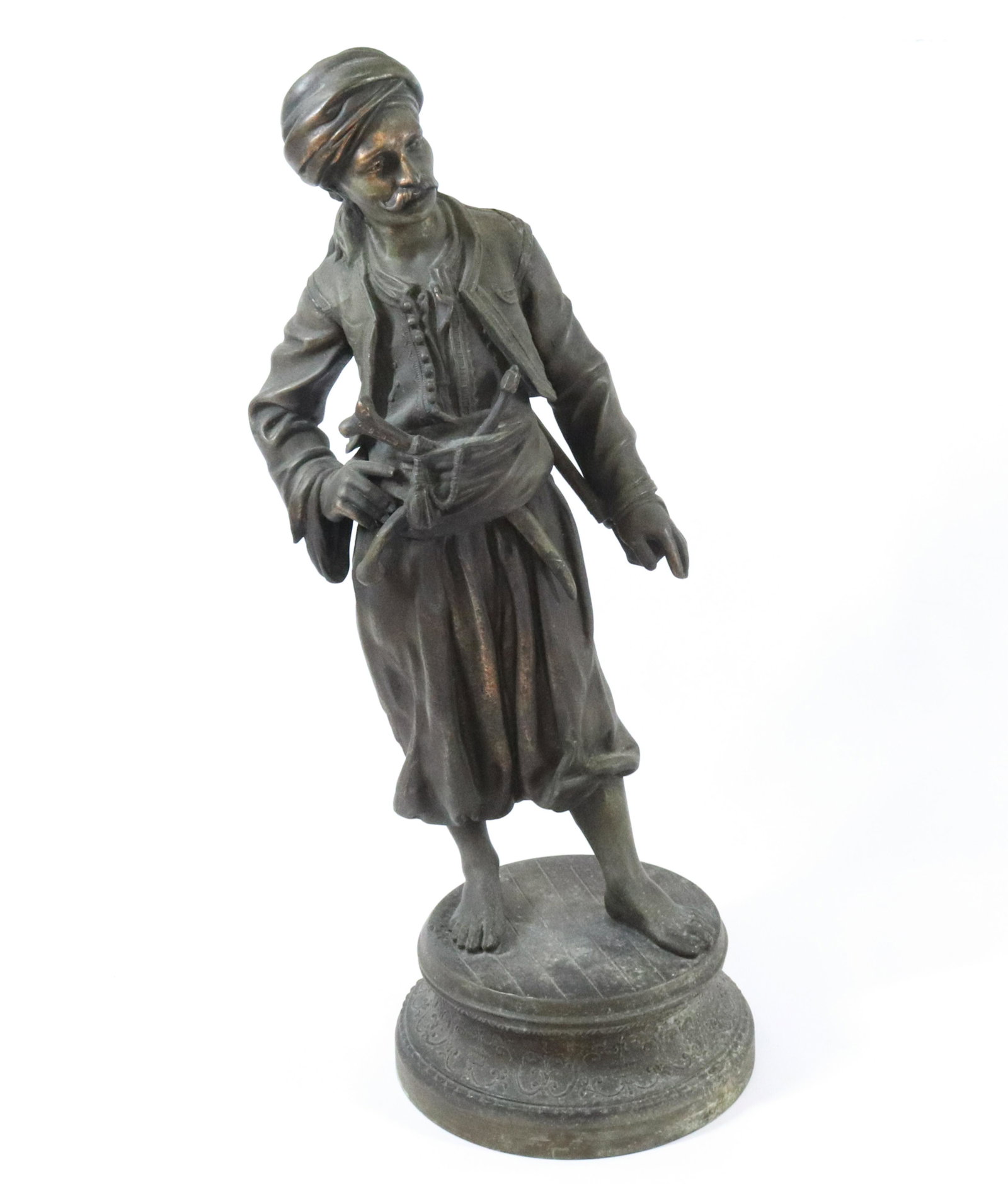 FRENCH SPELTER STATUE: BRONZE PLATED MAGYAR WITH TURBIN,RIFLE AND DAGGER SIGNED AT LEFT FOOT DIMENSIONS: 25"H X 8 3/4" TERMS: Hartzell's Auction Gallery will handle most of the shipping in-house. WE do reserve the right to 