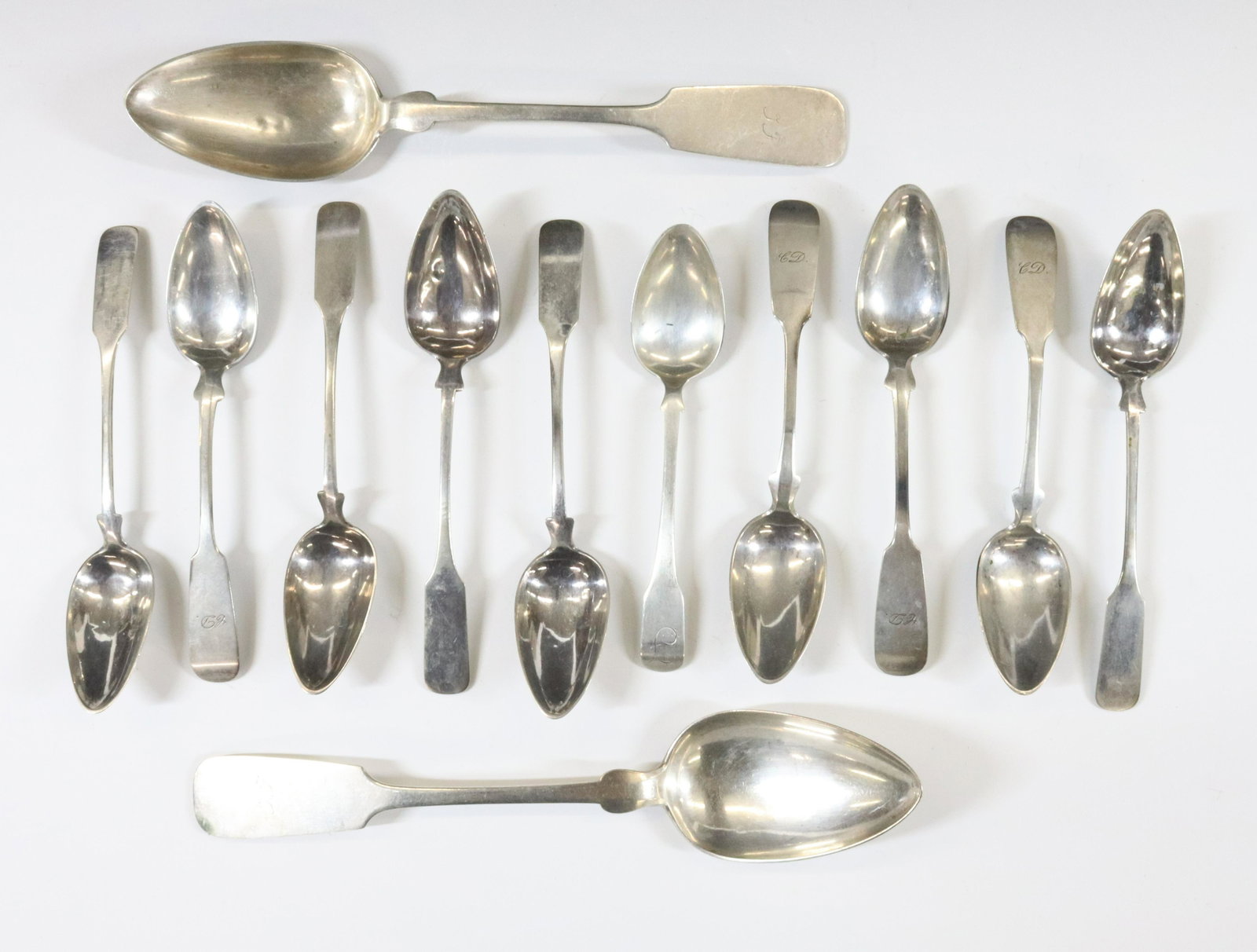 EARLY GERMAN SILVER: (13) INCLUDING TWO TABLE SPOONS SET OF SIX AND SET OF FOUR TEASPOONS TOTAL 8.23 OZT DIMENSIONS: 6" 8 3/4" TERMS: Hartzell's Auction Gallery will handle most of the shipping in-house. WE do reserve the
