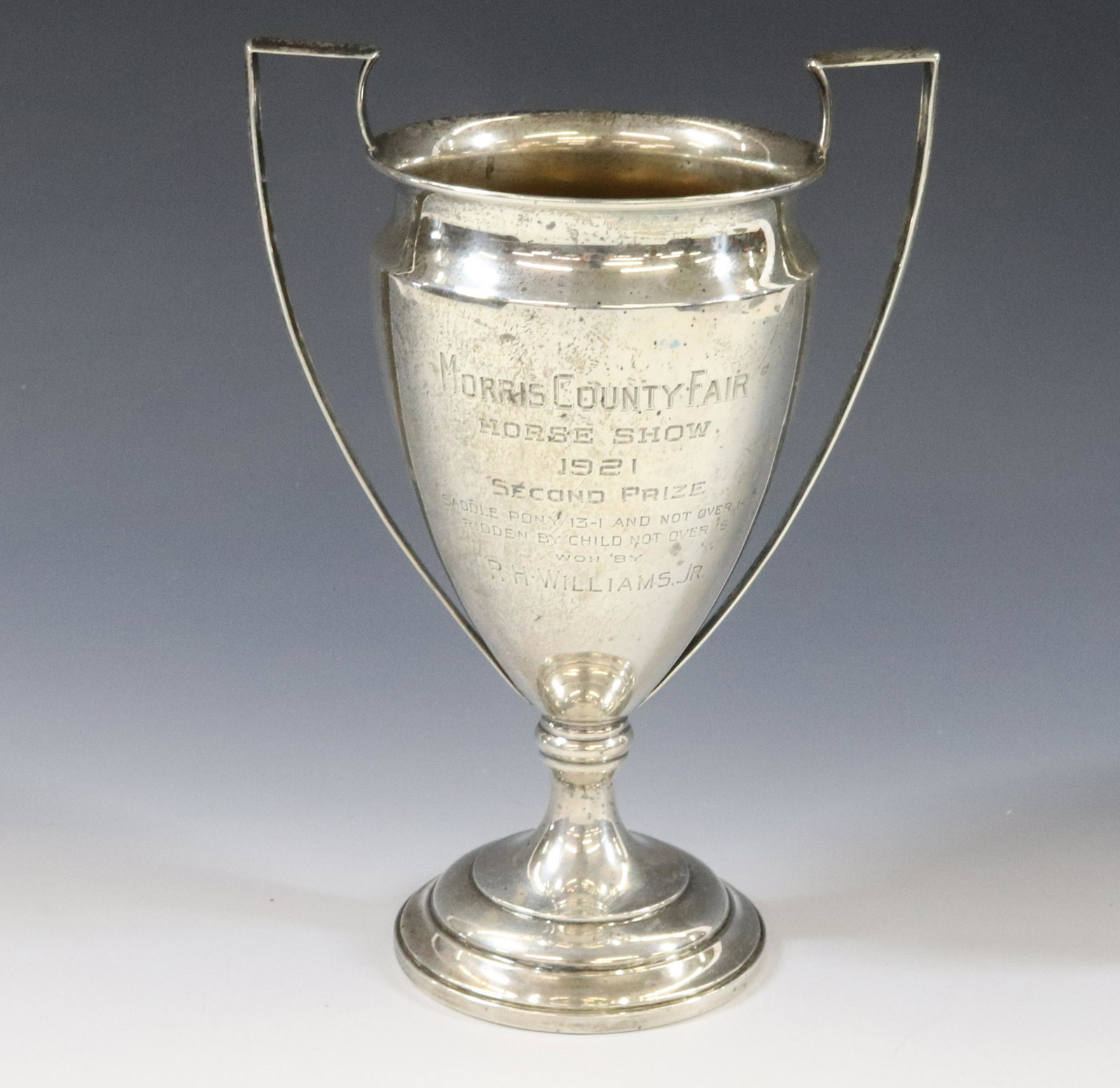 STERLING SILVER HORSE TROPHY: BLACK STARR & FROST 1921 MORRIS COUNTY FAIR WITH WEIGHTED BASE DIMENSIONS: 7"H X 5 1/2" TERMS: Hartzell's Auction Gallery will handle most of the shipping in-house. WE do reserve the right to not ship