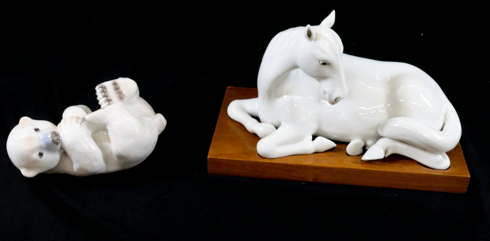 PORCELAIN FIGURINES: (2) CHINESE BLANC DE CHINE HORSE AND ROYAL COPENHAGEN YOUNG POLAR BEAR DIMENSIONS: 6 1/2"H X 10" 4"H X 6 1/2" TERMS: Hartzell's Auction Gallery will handle most of the shipping in-house. WE do reserve