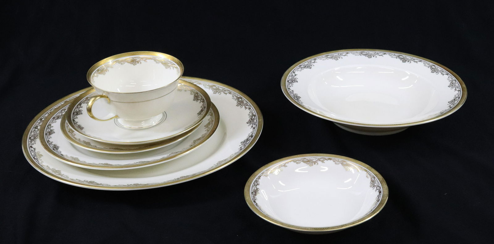 SERVICE FOR ELEVEN WITH EXTRA PIECES ROSENTHAL CHINA 79 TOTAL PIECES: GOLDEN AIDA #5152, ROSENTHAL GILT RIM WITH VINE FLOWERS, 12 10" PLATYES, 12 7 1/2" PLATES, 12 6 1/4" PLATES, 11 CUPS, 11 SAUSERS, 12 SOUP BOWLS, 12 DESSERTS, 2 OVAL PLATTERS, GRAVEY BOAT TEA POT, SUGA