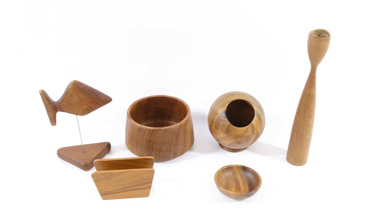 GROUP LOT OF DANISH MODERN TABLETOP ACCESSORIES: INCLUDING: FISH ON BASE, NAPKIN HOLDER, BOWL, SMALL BOWL, CANDLESTICK (STICKER MADE IN DENMARK) AND SPHERICAL HOLDER WITH OPENING AND BASE DIMENSIONS: CANDLESTICK 11 1/2" H TERMS: Hartzell's Auction G