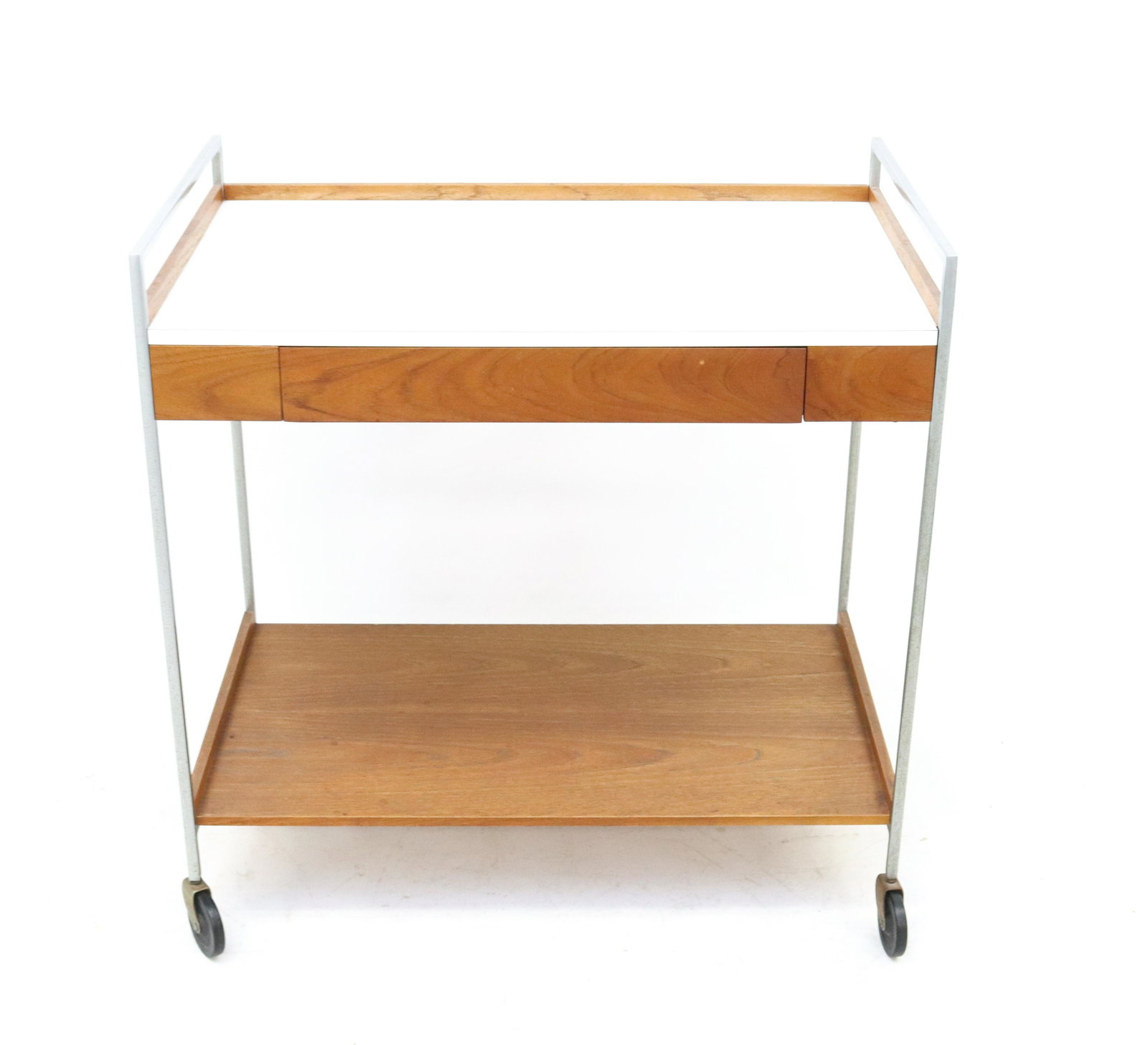 GEORGE NELSON FOR HERMAN MILLER SERVING CART: LAMINATED TOP ON WALNUT BASE WITH STEEL SUPPORTS. LABELED IN DRAWER. PULL-OUT SIDE SURFACE DIMENSIONS: 31" X 30 1/2" X 18" TERMS: Hartzell's Auction Gallery will handle most of the shipping in-house. 