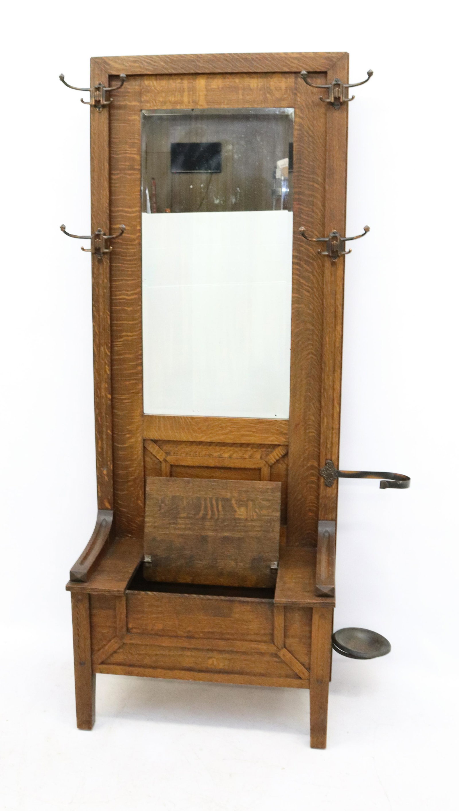 OAK HALL RACK WITH MIRRORED BACK: HALL RACK WITH BEVELED MIRROR, LIFT-UP STORAGE SEAT, FOUR METAL HOOKS AND SIDE UMBRELLA HOLDER DIMENSIONS: 75" X 29" X 16" TERMS: Hartzell's Auction Gallery will handle most of the shipping in-house. 