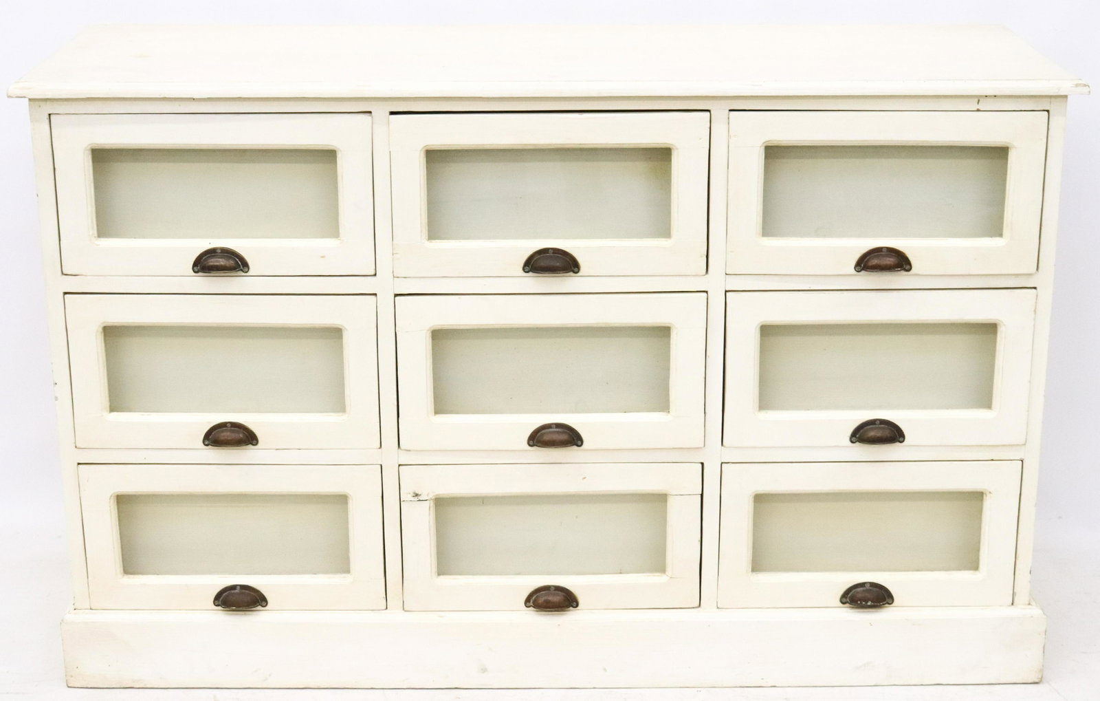 VINTAGE PAINTED SEED CABINET (BARBARA STREISAND): NINE DRAWERS WITH GLASS FRONTS AND BRASS HANDLE PULLS. PANELED SIDES. FROM JULIEN'S AUCTIONS OF "THE COLLECTION OF BARBARA STREISAND, LOT 378" DIMENSIONS: 35 1/2" X 57" X 19 1/4" TERMS: Hartzell's Auc