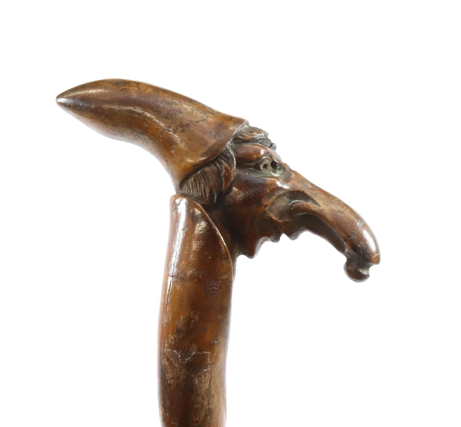 CARVED WOODEN CANE "BIRD MAN": LARGE NOSE OR BEAK WEARING POINTY CAP Size: 34 1/2" L Terms: Hartzell's Auction Gallery will handle most of the shipping in-house. WE do reserve the right to not ship some large items, larger lots of