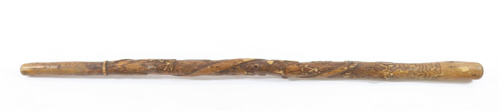 FOLK ART CARVED WOODEN CANE: CARVED SURFACE WITH "IN GOD WE TRUST", MAN ON STUMP, LADDER, SCISSORS, BIRDS AND MORE Size: 33 1/2" L Terms: Hartzell's Auction Gallery will handle most of the shipping in-house. WE do reserve the rig